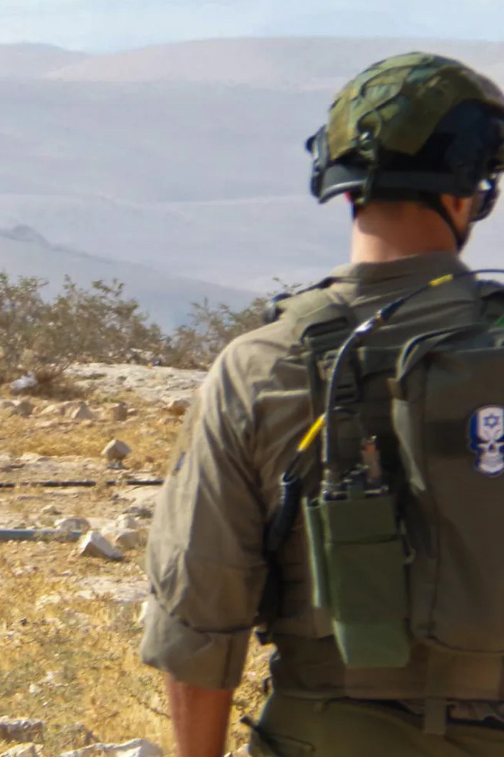 Back of an Israeli soldier in the occupied West Bank [File: Al Jazeera]