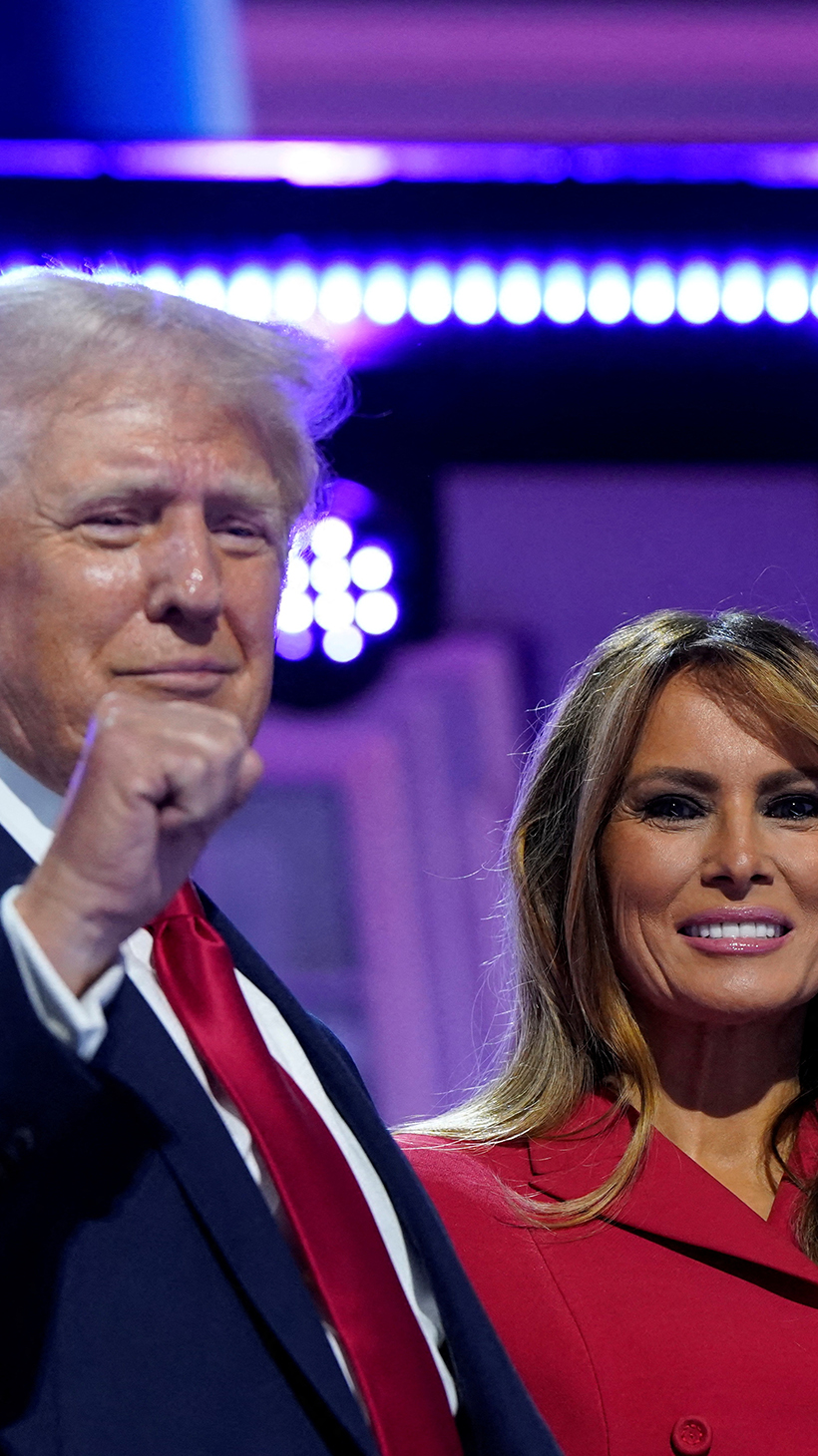 Donald Trump, with a bandage on his ear, and Melania Trump pose together at the Republican National Convention in 2024.