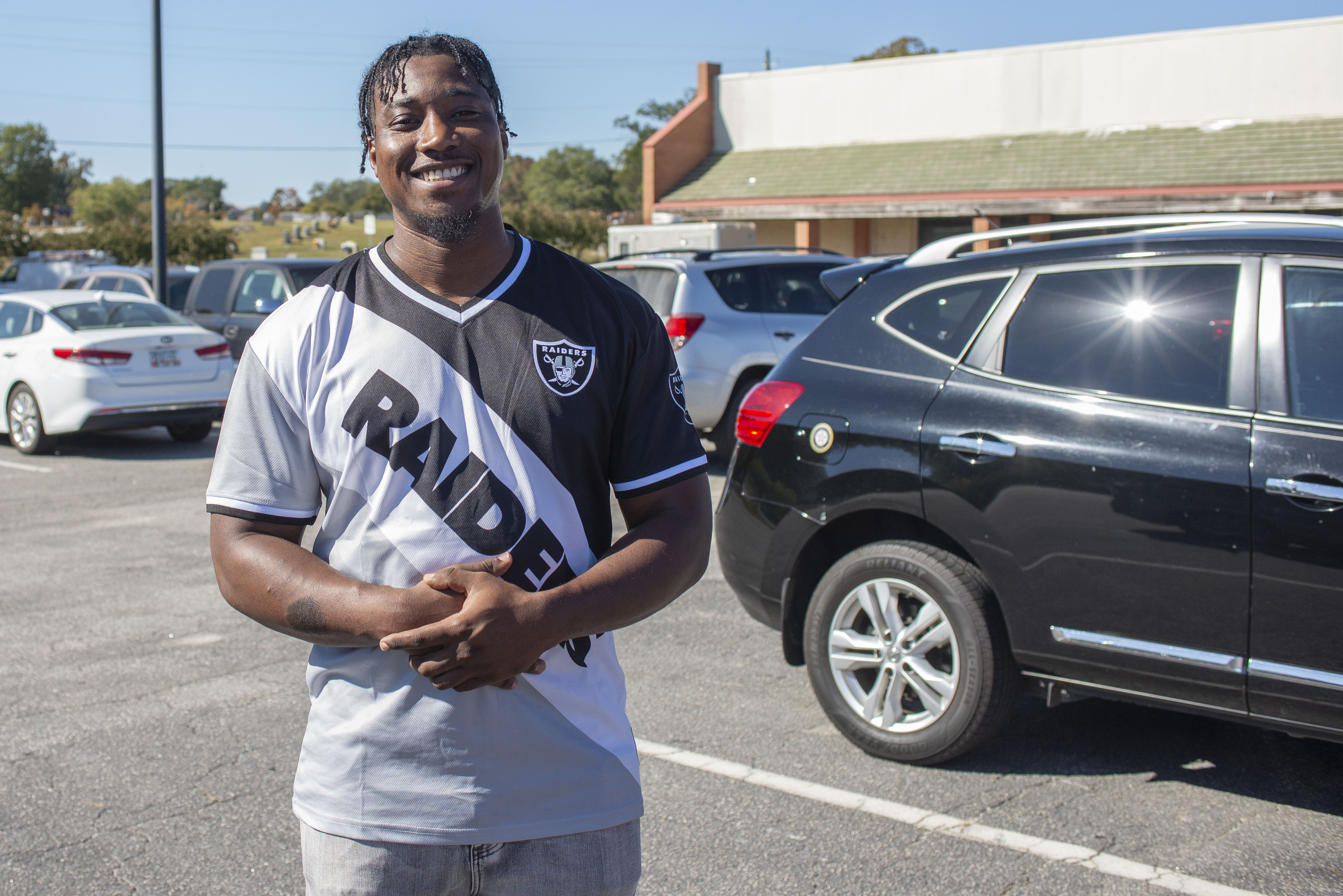 A voter smiles after casting a ballot in Spalding County, GA [Joseph Stepansky/Al Jazeera]