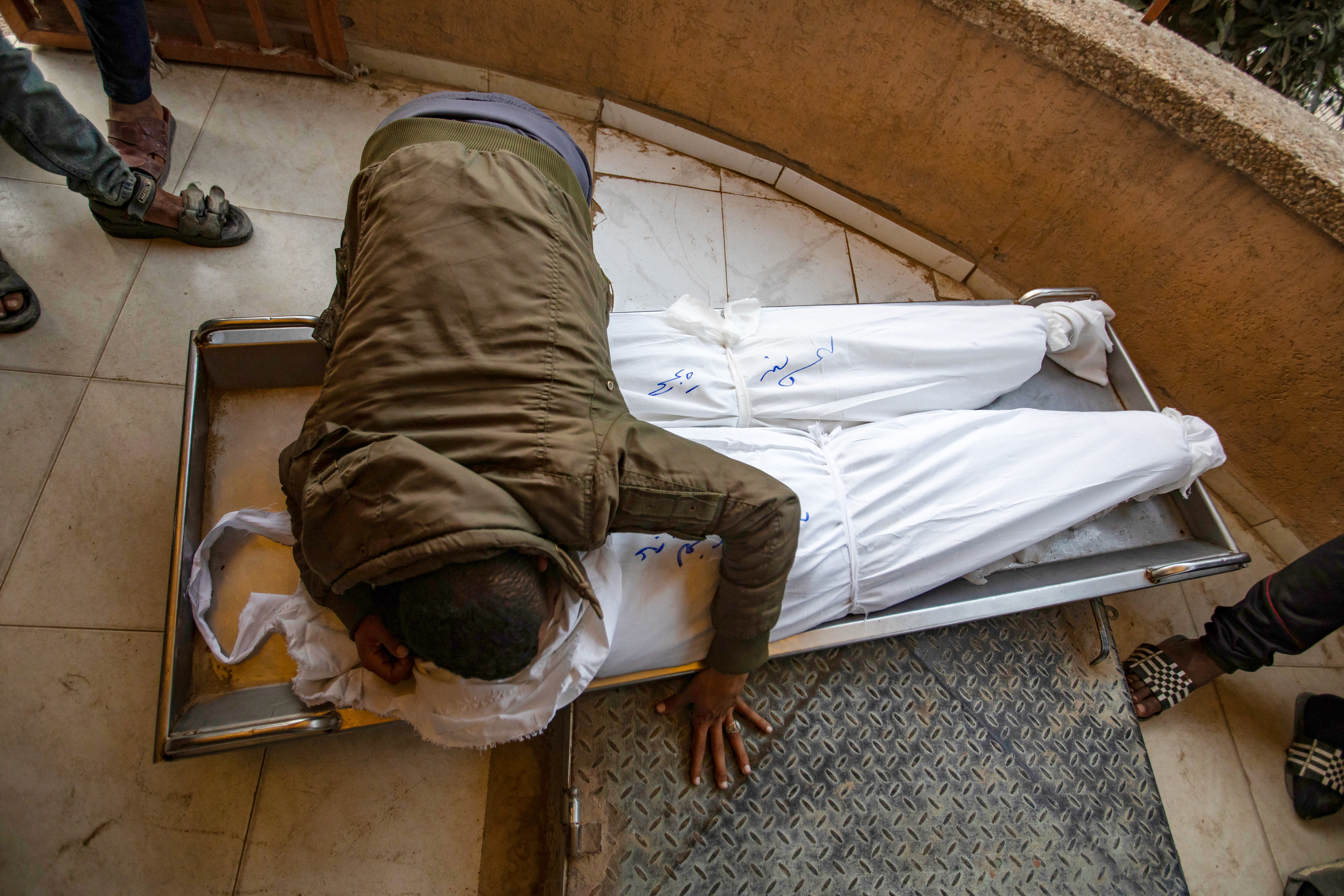epa11731377 A man cries over the bodies of his relatives who were killed in an Israeli airstrike on the Al-Mawasi area, at Nasser Hospital in Khan Younis, southern Gaza Strip, 20 November 2024. More than 43,900 Palestinians and over 1,400 Israelis have been killed, according to the Palestinian Health Ministry and the Israeli Army, since Hamas militants launched an attack against Israel from the Gaza Strip on 07 October 2023, and the Israeli operations in Gaza and the West Bank which followed it. EPA-EFE/HAITHAM IMAD