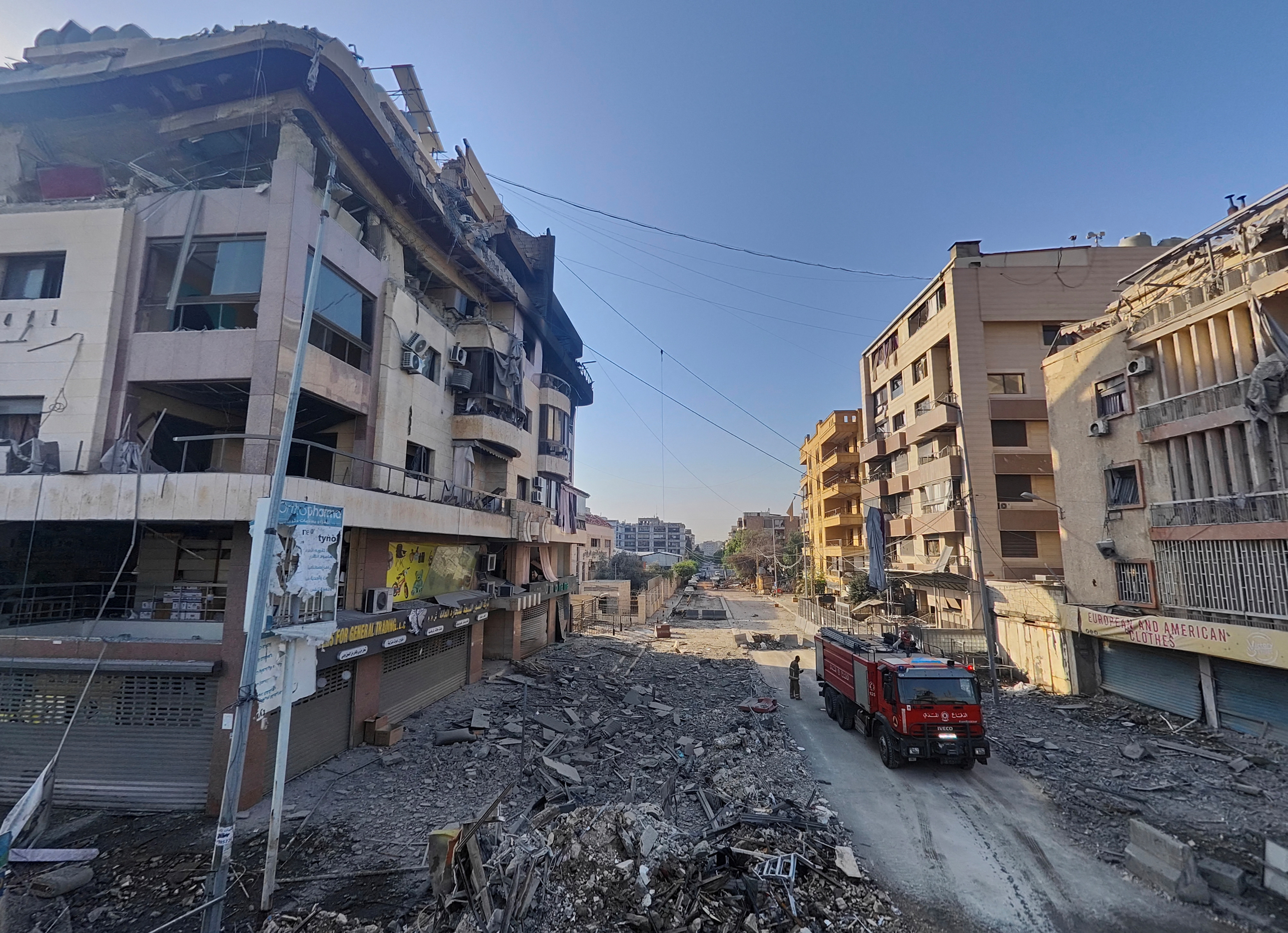 A civil defence vehicle is seen at a site damaged in the aftermath of Israeli strikes on Beirut's southern suburbs