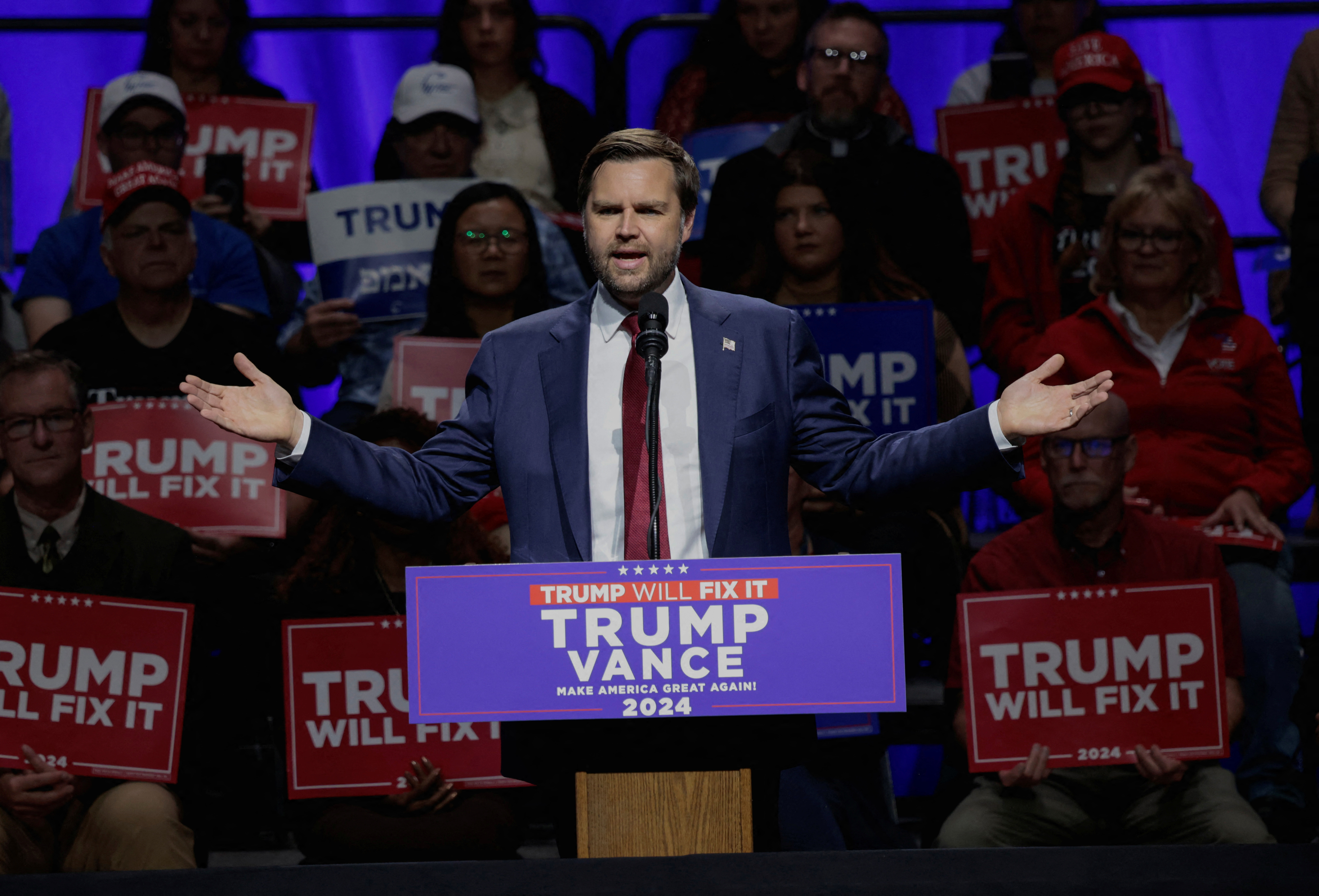 Republican vice presidential nominee JD Vance speaks to supporters during a campaign stop at the Capitol Theatre in Flint, Michigan, U.S. November 4, 2024. REUTERS/Rebecca Cook
