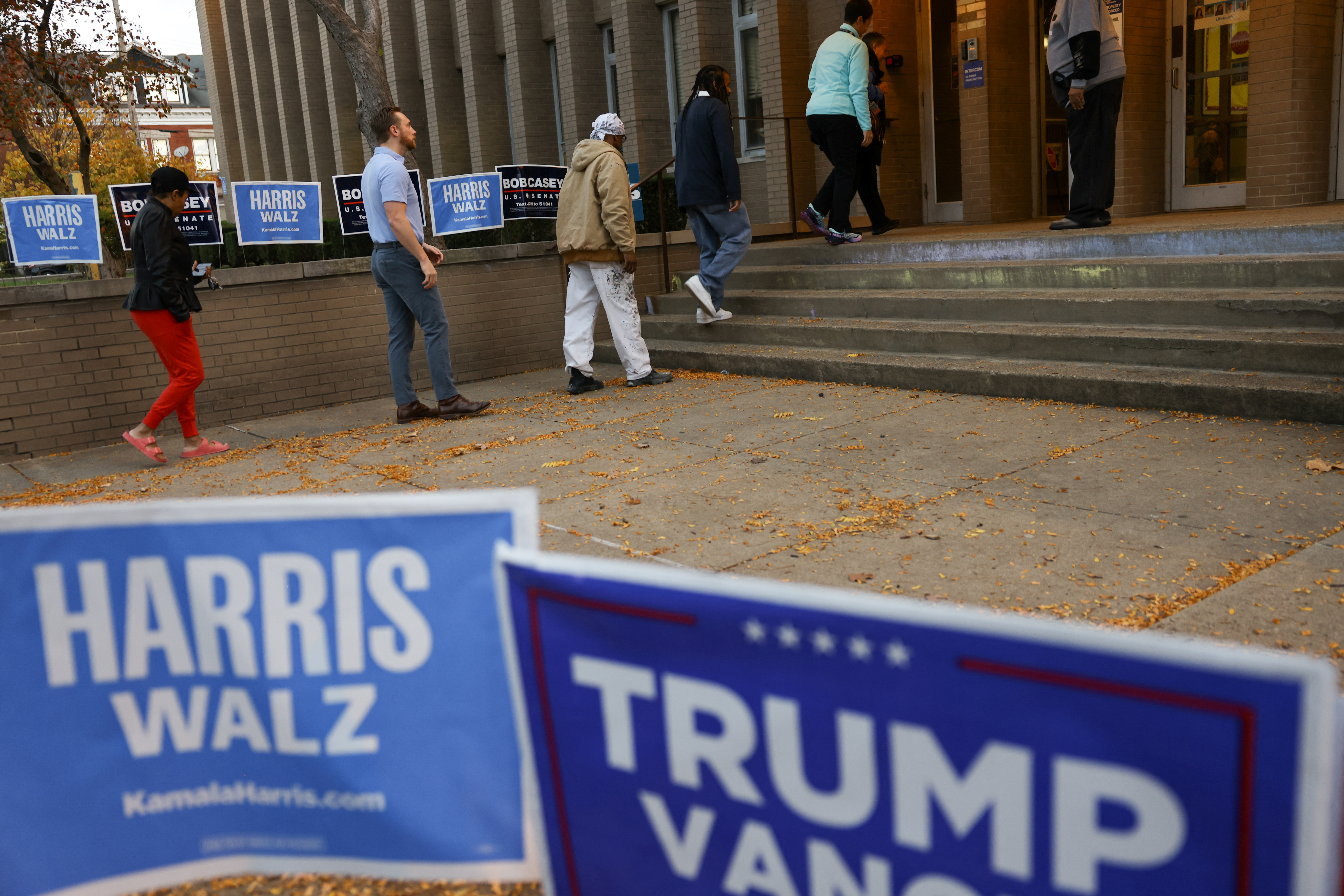 People line up to cast their votes in the 2024 U.S. presidential election on Election Day, at Pittsburgh Manchester School in Pittsburgh, Pennsylvania