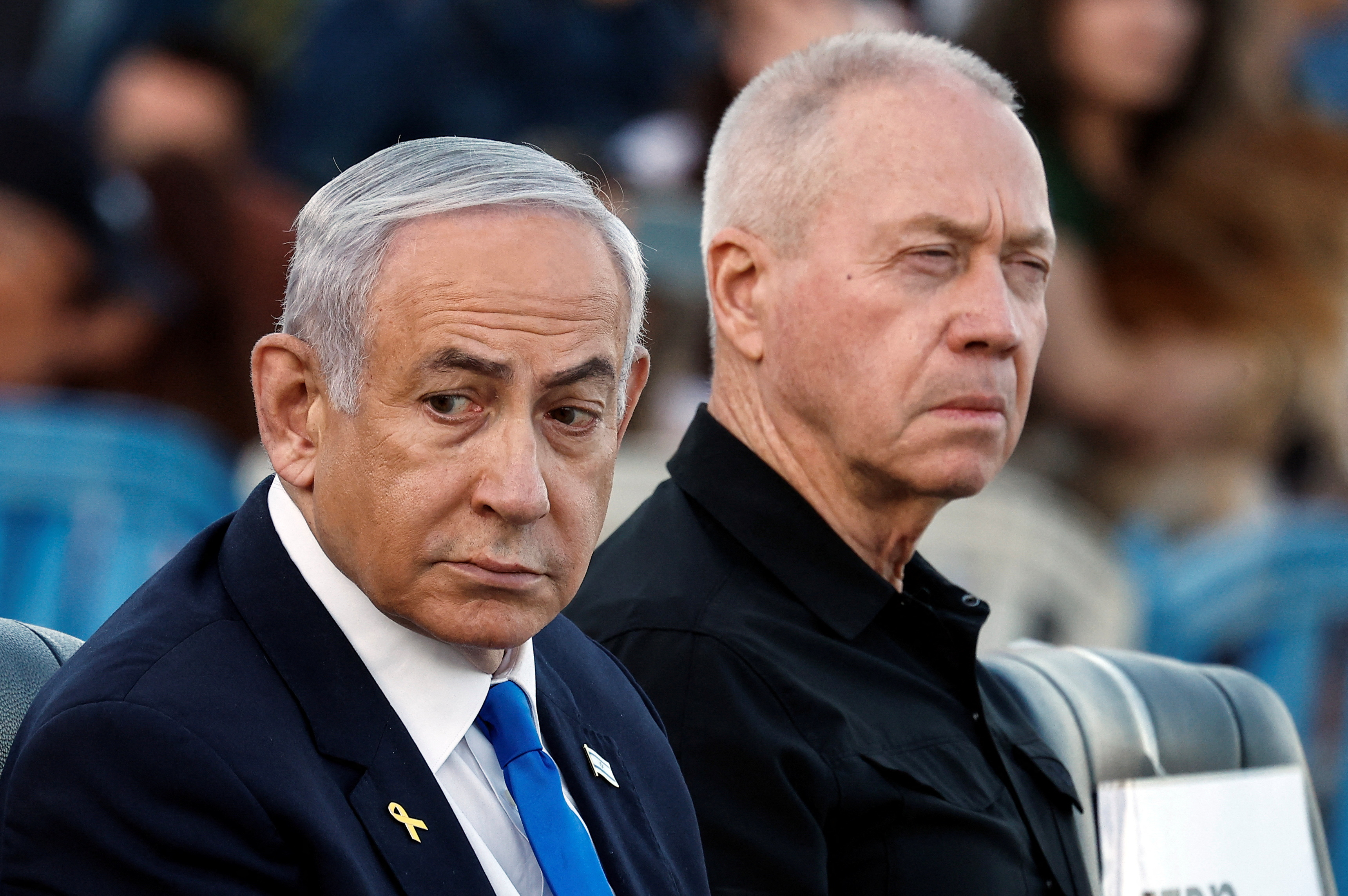 Israeli Prime Minister Benjamin Netanyahu and Israeli Defense Minister Yoav Gallant attend a ceremony for the 70th cohort of military combat officers, at an army base near Mitzpe Ramon, Israel, October 31, 2024. REUTERS/Amir Cohen
