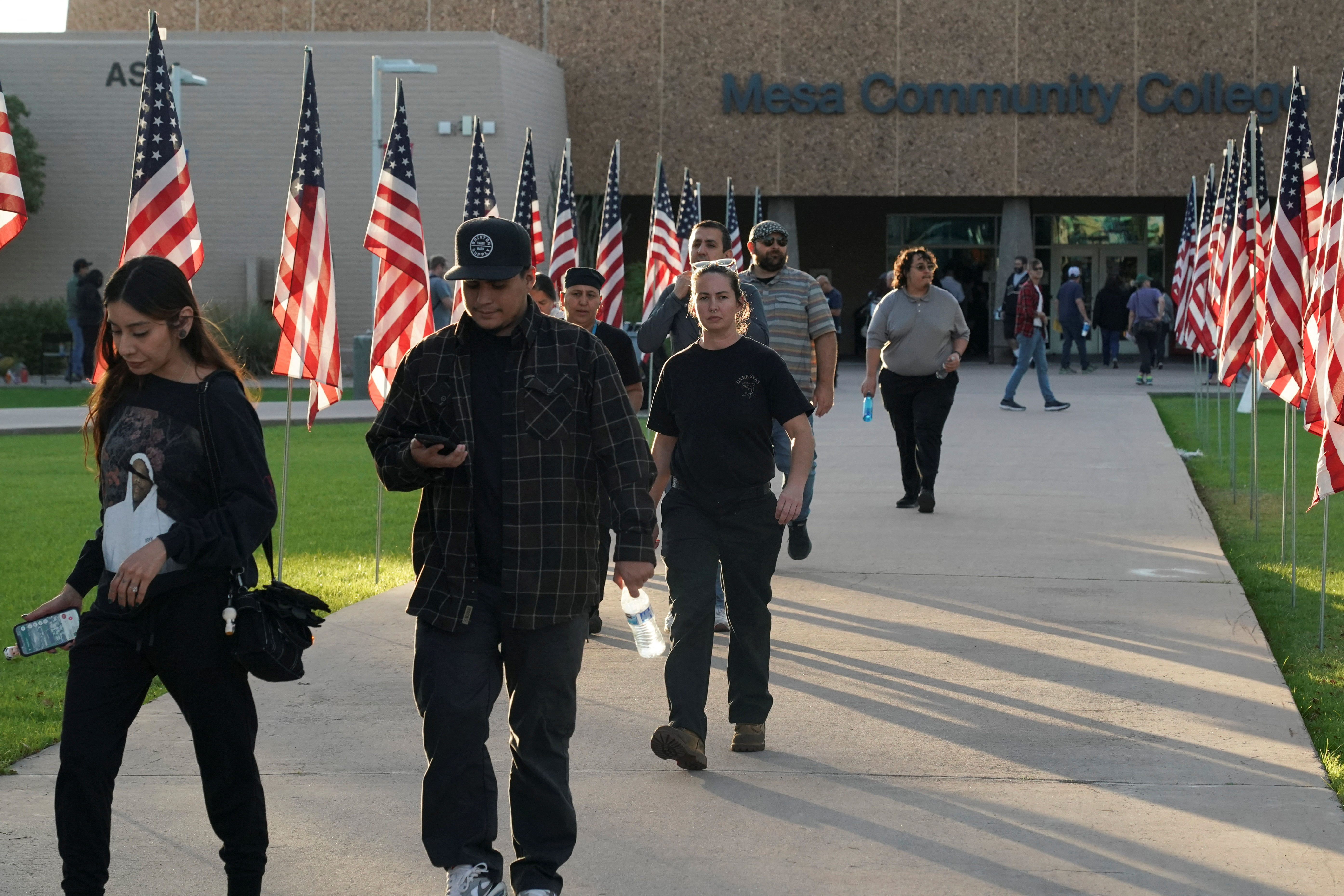 Voters file in and out of a Maricopa County polling station.