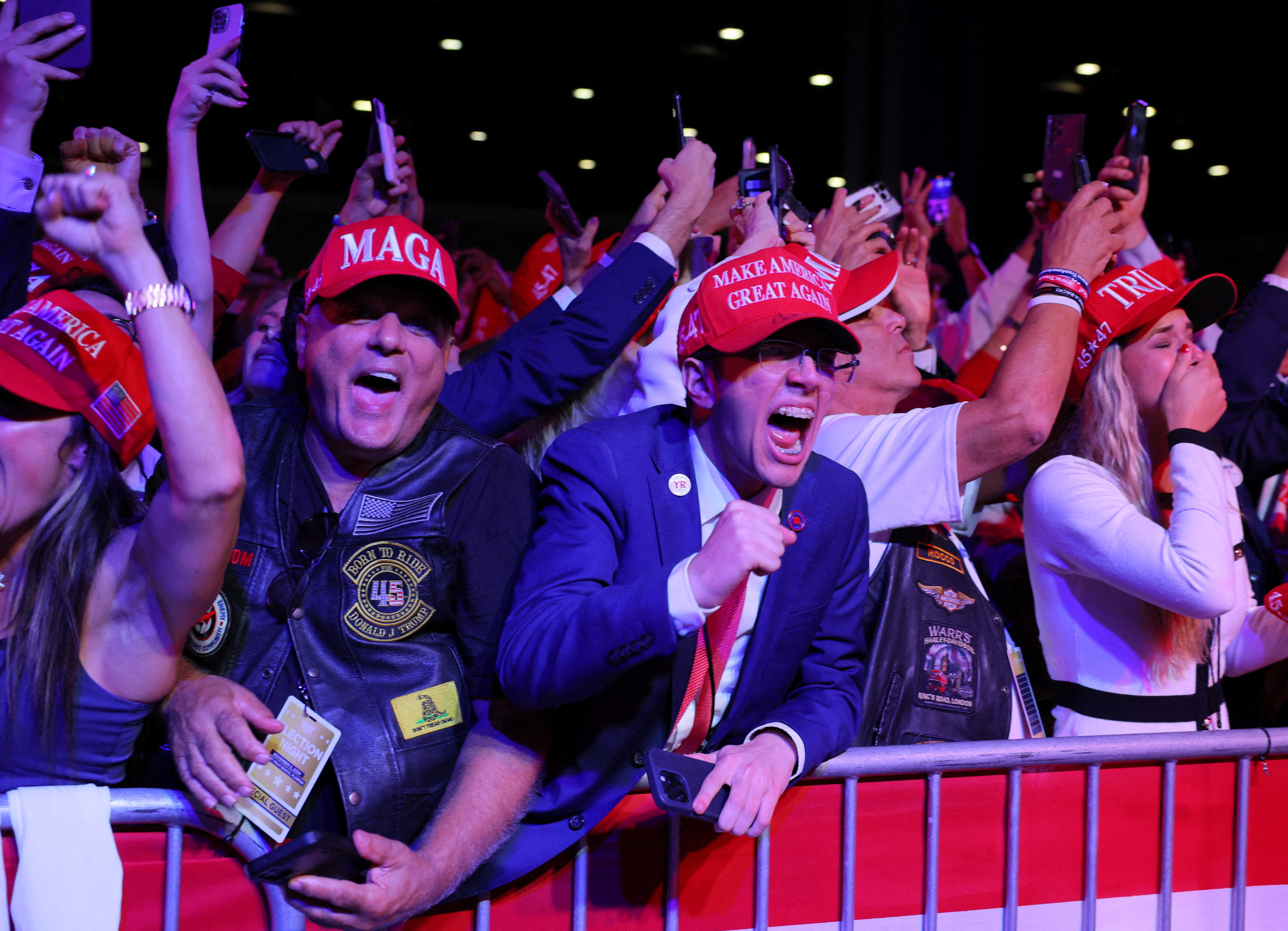 Supporters of Republican presidential nominee and former U.S. President Donald Trump celebrate after the Fox Network called the election in his favor at the site of his rally, at the Palm Beach County Convention Center in West Palm Beach, Florida, U.S., November 6