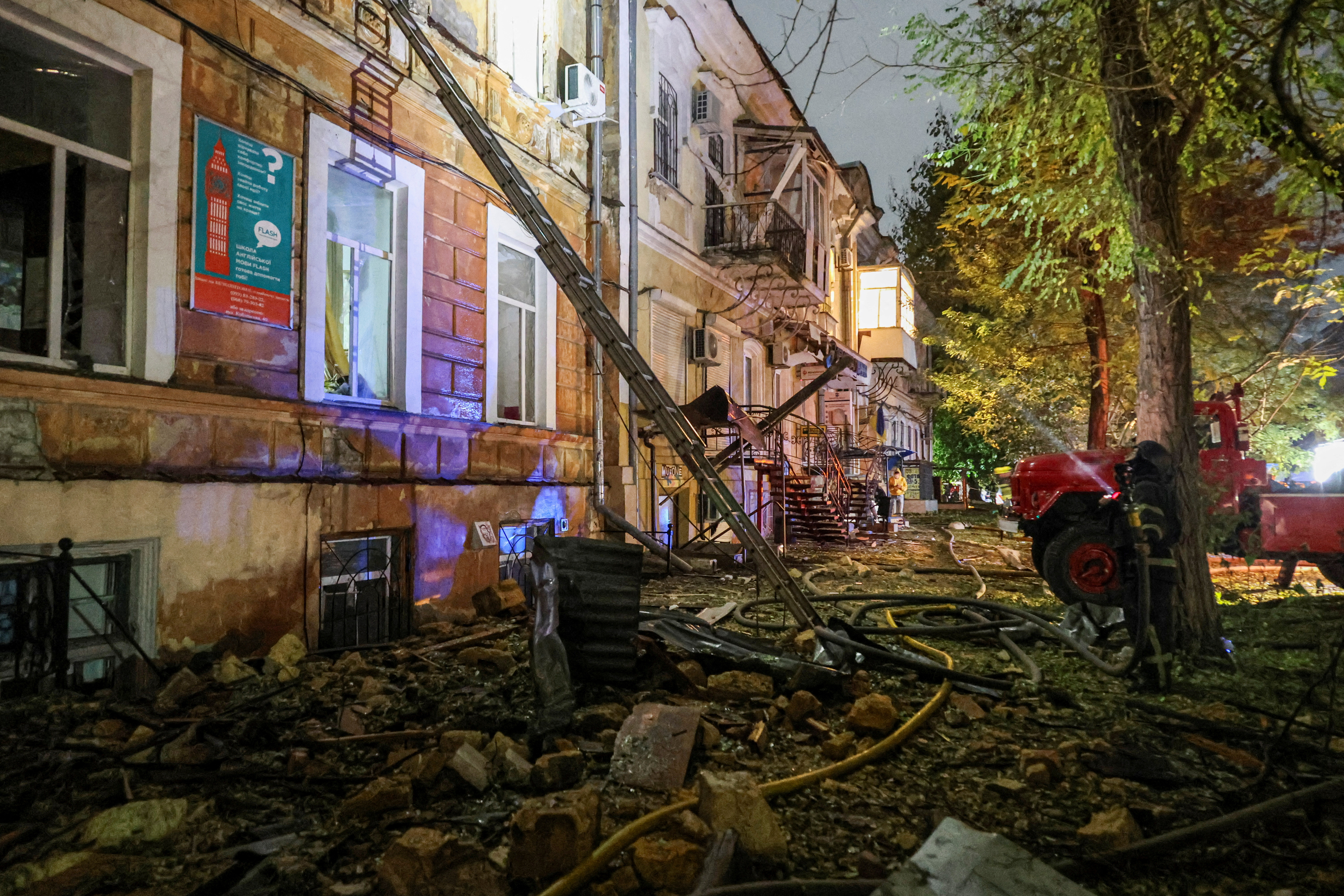 Firefighters work at the site of an attack in Odesa
