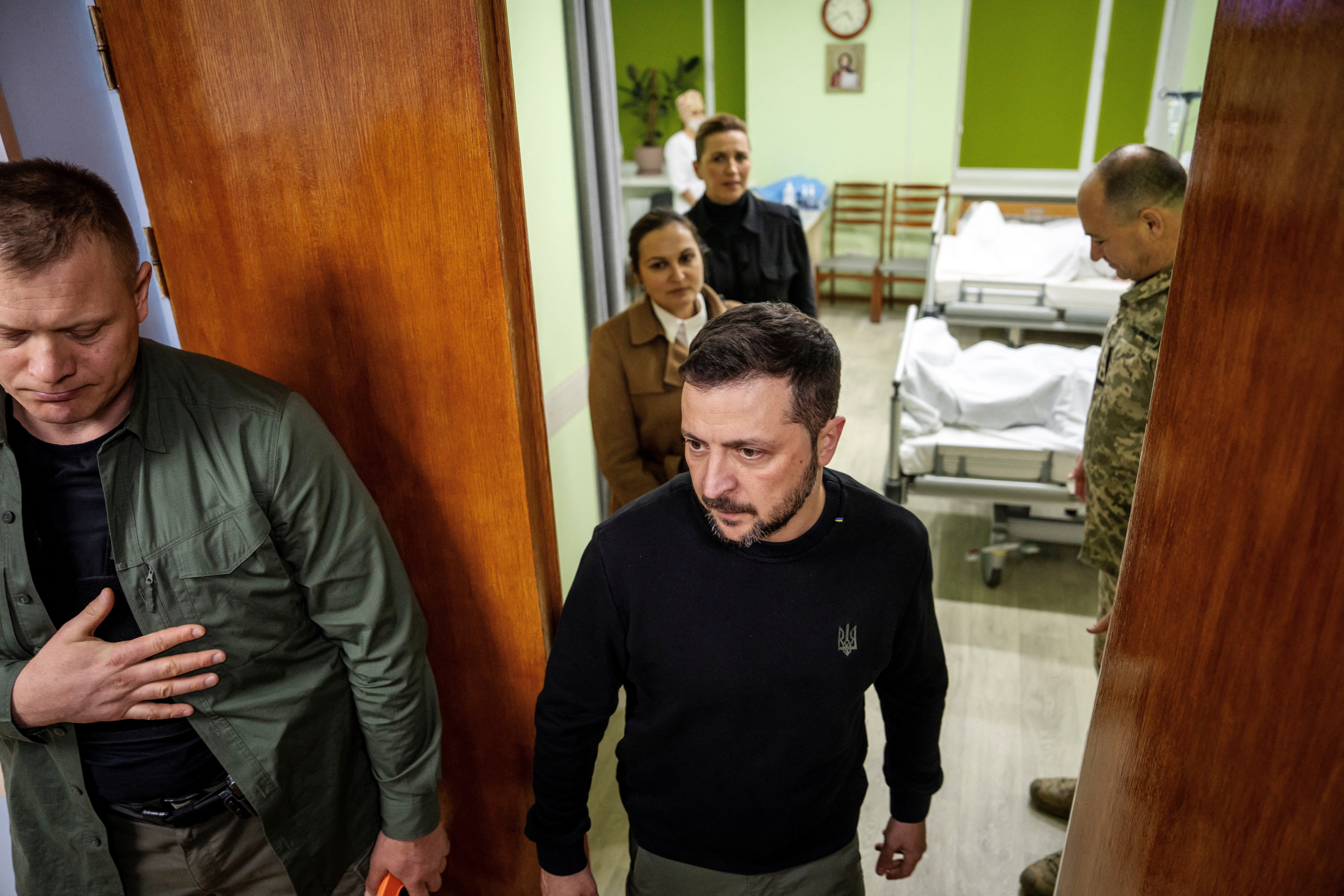 Ukraine's President Volodymyr Zelenskiy visits a military hospital alongside Denmark's Prime Minister Mette Frederiksen, on the 1000th day of Russia's full-scale attack on Ukraine, in Kyiv, Ukraine, November 19, 2024. Mads Claus Rasmussen/Ritzau Scanpix/via REUTERS ATTENTION EDITORS - THIS IMAGE WAS PROVIDED BY A THIRD PARTY. DENMARK OUT. NO COMMERCIAL OR EDITORIAL SALES IN DENMARK.