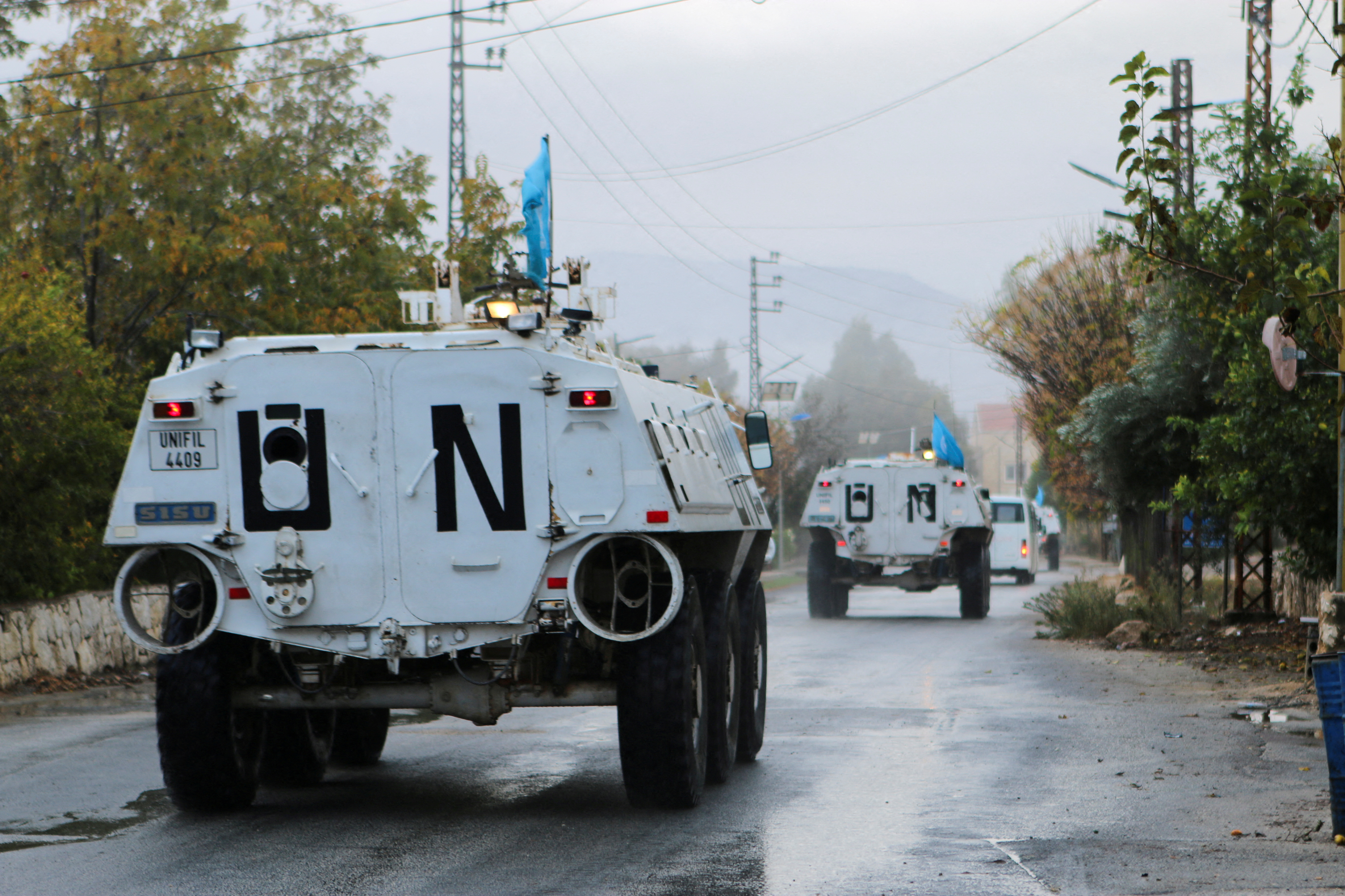 FILE PHOTO: UN peacekeepers (UNIFIL) vehicles ride along a street amid ongoing hostilities between Hezbollah and Israeli forces, in Marjayoun, near the border with Israel, southern Lebanon November 19, 2024. REUTERS/Karamallah Daher/File Photo
