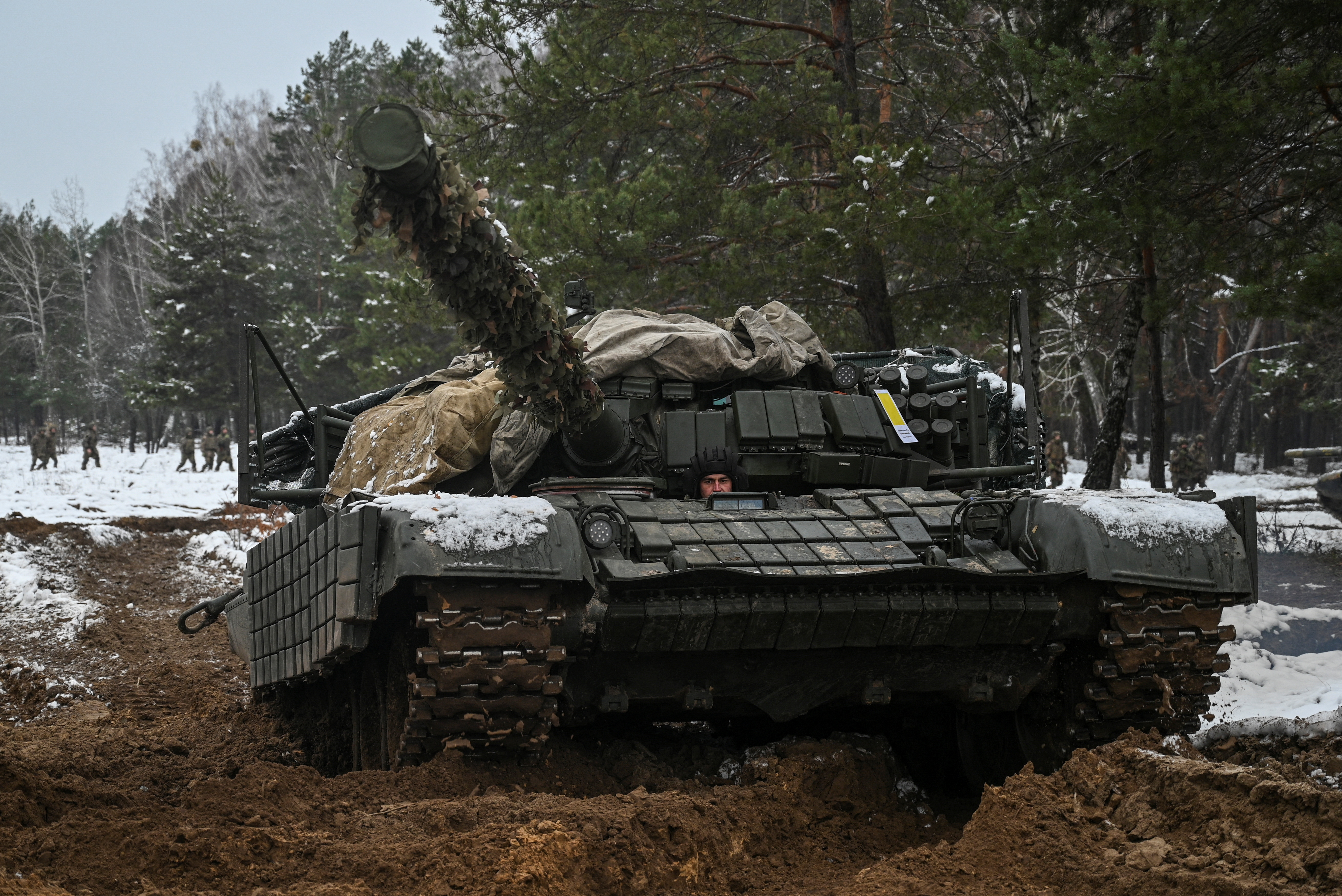 A Ukrainian service member drives a tank during military drills at a training ground, amid Russia's attack on Ukraine, in Chernihiv region, Ukraine, November 22, 2024. REUTERS/Maksym Kishka