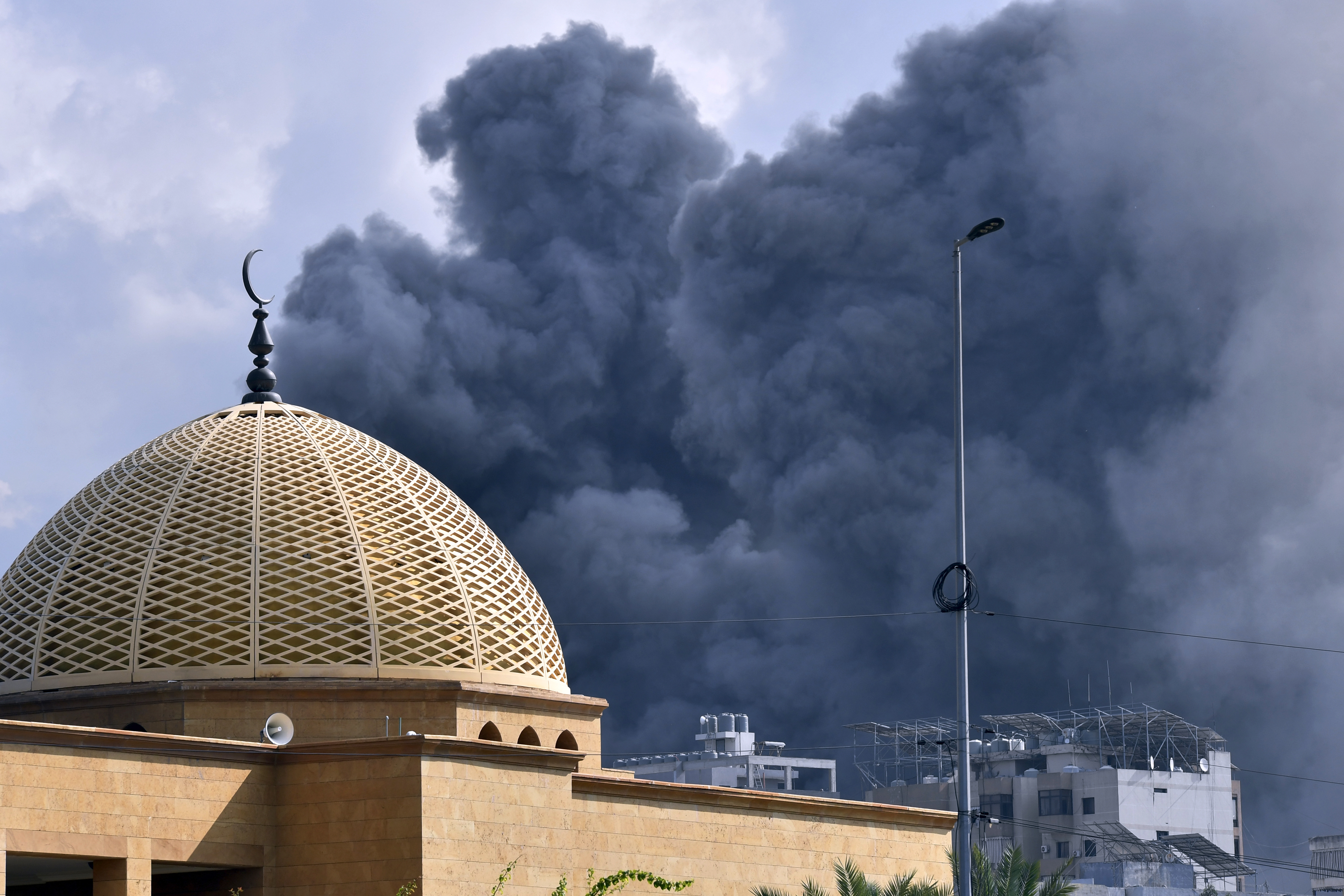BEIRUT, LEBANON - NOVEMBER 13: Smoke rises among the residential buildings following an Israeli attack on Ghobeiry municipality located in Dahieh region in Beirut, Lebanon on November 13, 2024. ( Houssam Shbaro - Anadolu Agency )