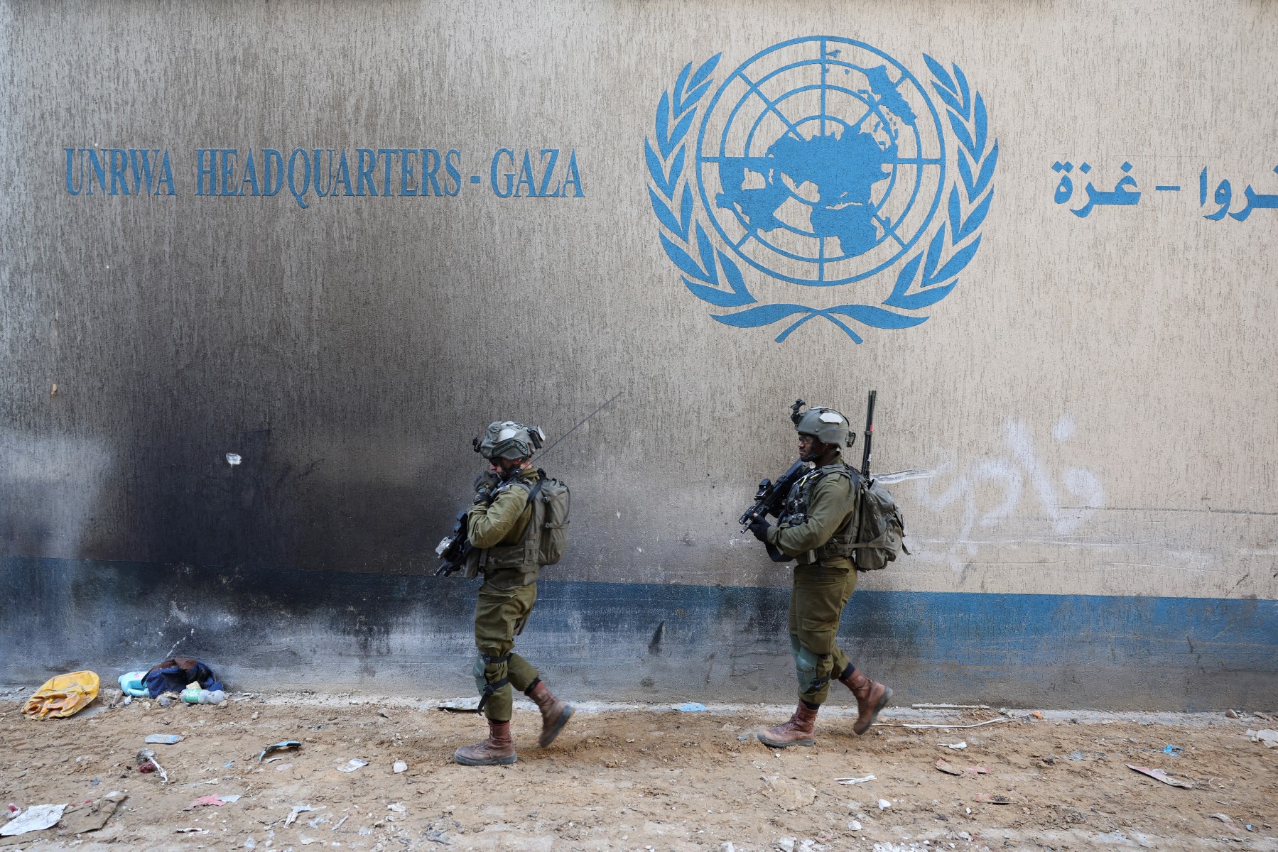 Israeli soldiers inside an evacuated compound of the United Nations Relief and Works Agency for Palestine Refugees (UNRWA) in Gaza City, February 8, 2024, [Jack Guez / AFP)