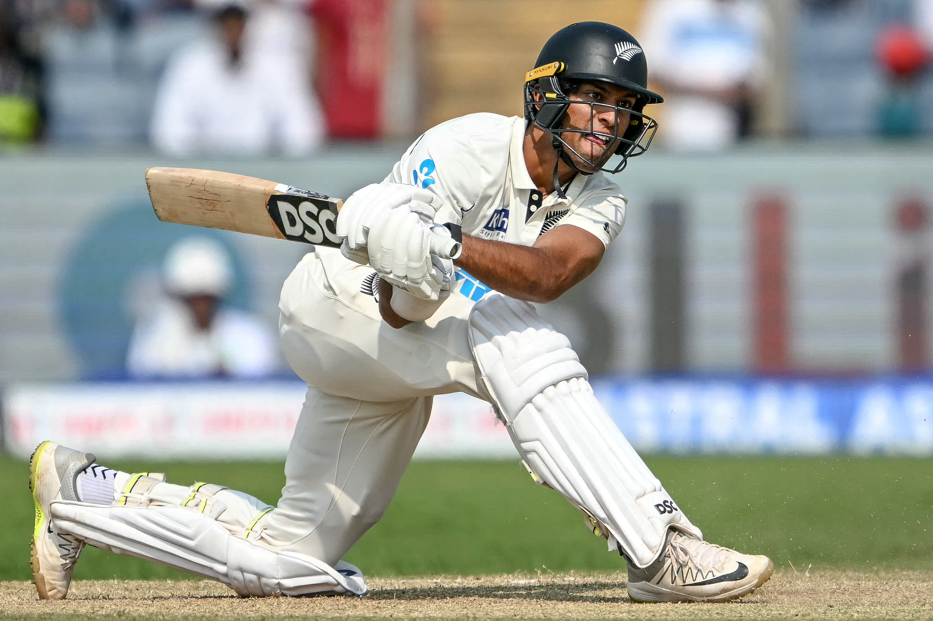 New Zealand's Rachin Ravindra plays a shot during the second day of the second Test cricket match between India and New Zealand at the Maharashtra Cricket Association Stadium in Pune on October 25, 2024. (Photo by Punit PARANJPE / AFP) / -- IMAGE RESTRICTED TO EDITORIAL USE - STRICTLY NO COMMERCIAL USE --