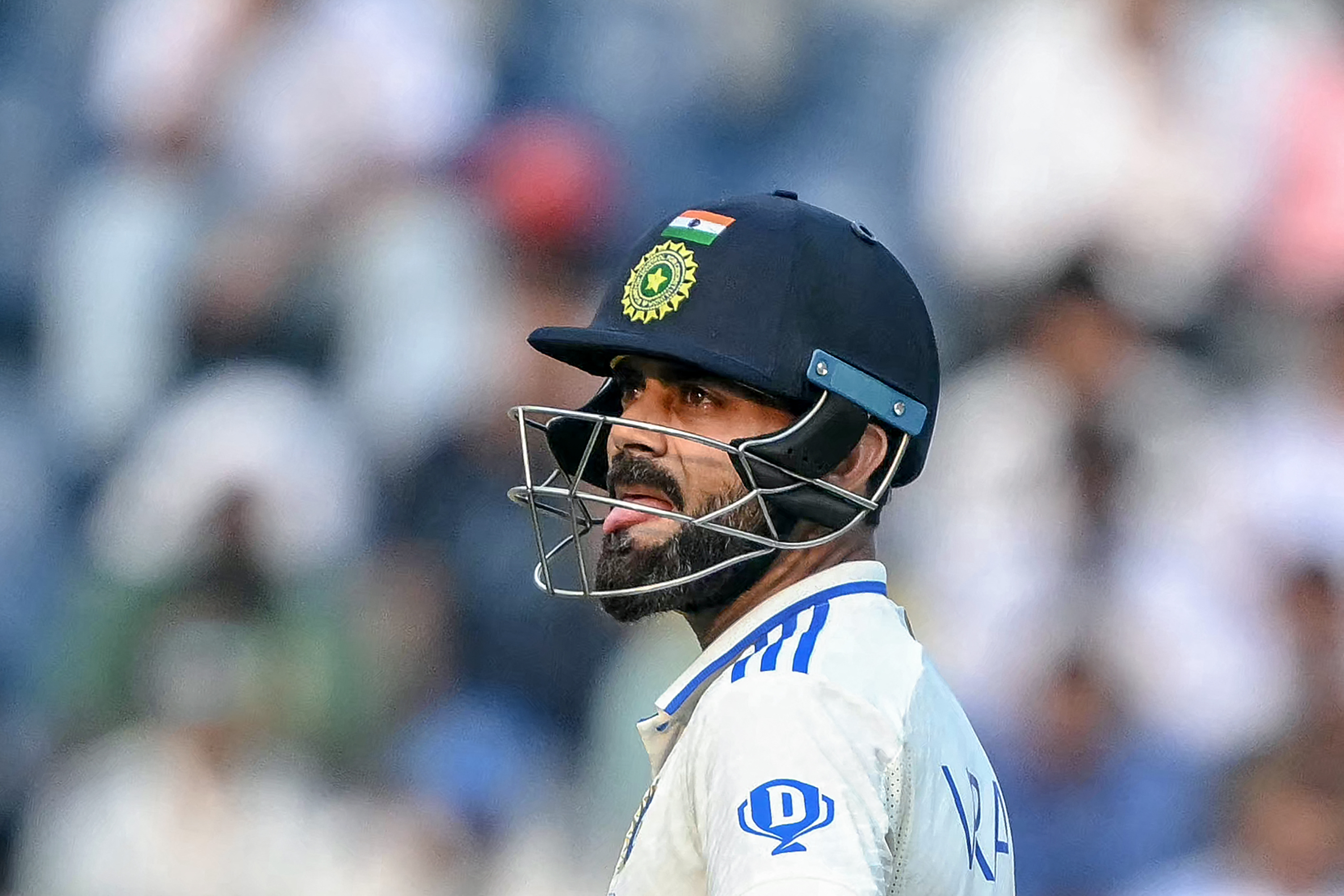 India's Virat Kohli reacts as he waits for an umpire decision