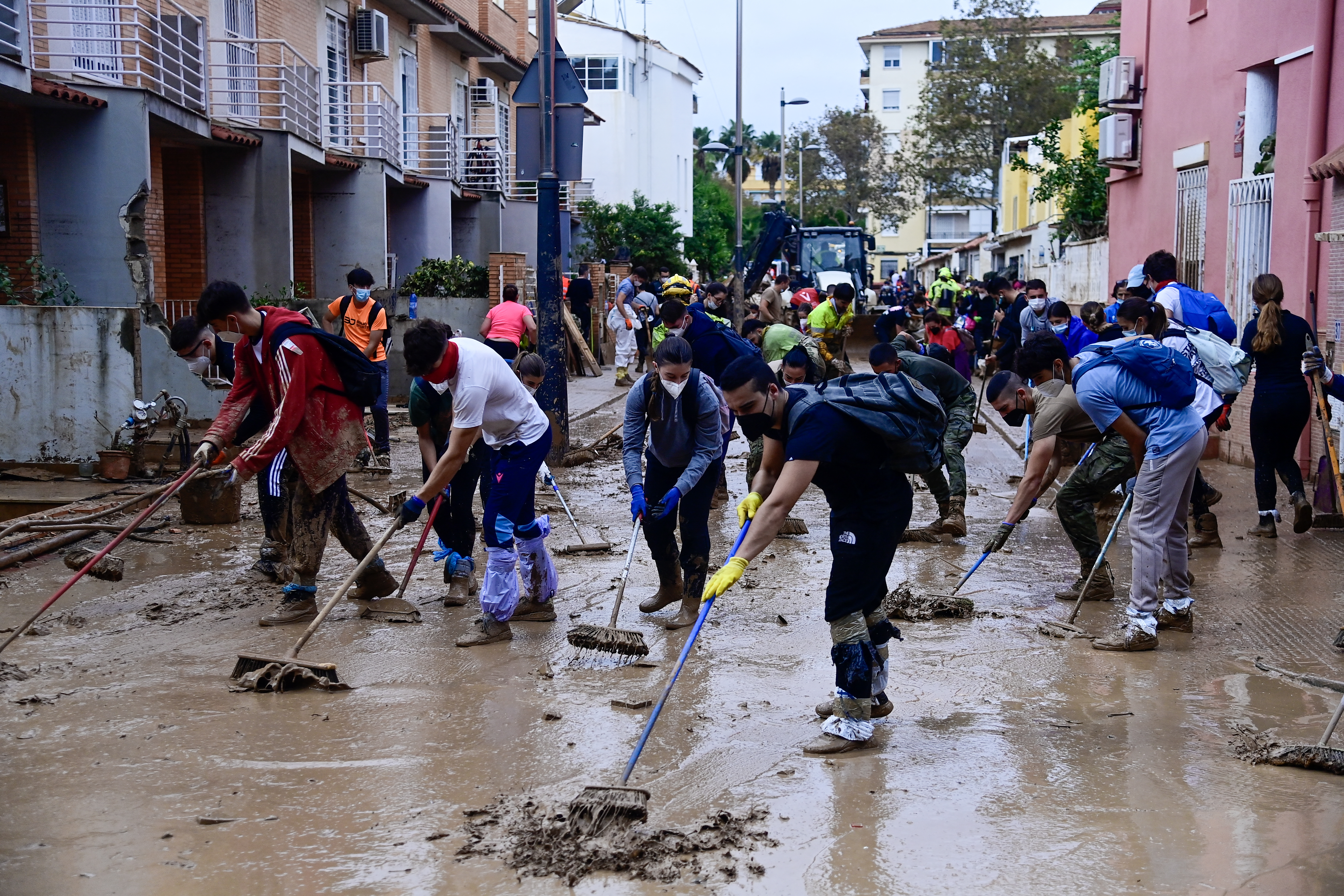 Heavy rains in Barcelona disrupt rail service as troops search for more flood victims in Valencia