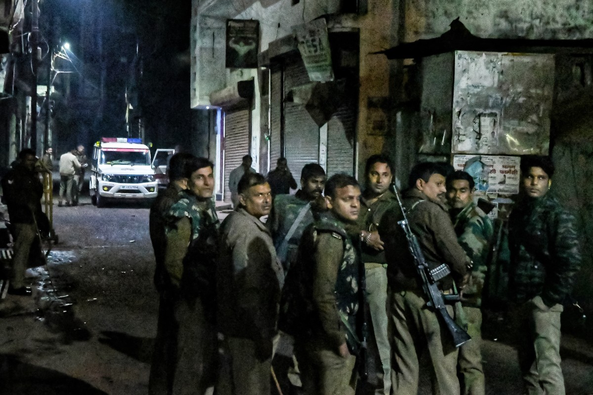 Armed police personnel stand guard following religious violence near the Shahi Jama Masjid in Sambhal on November 24, 2024. - Indian Muslim protesters clashed with police on November 24, with at least two people killed in riots sparked by a survey investigating if a 17th-century mosque was built on a Hindu temple. (Photo by AFP)