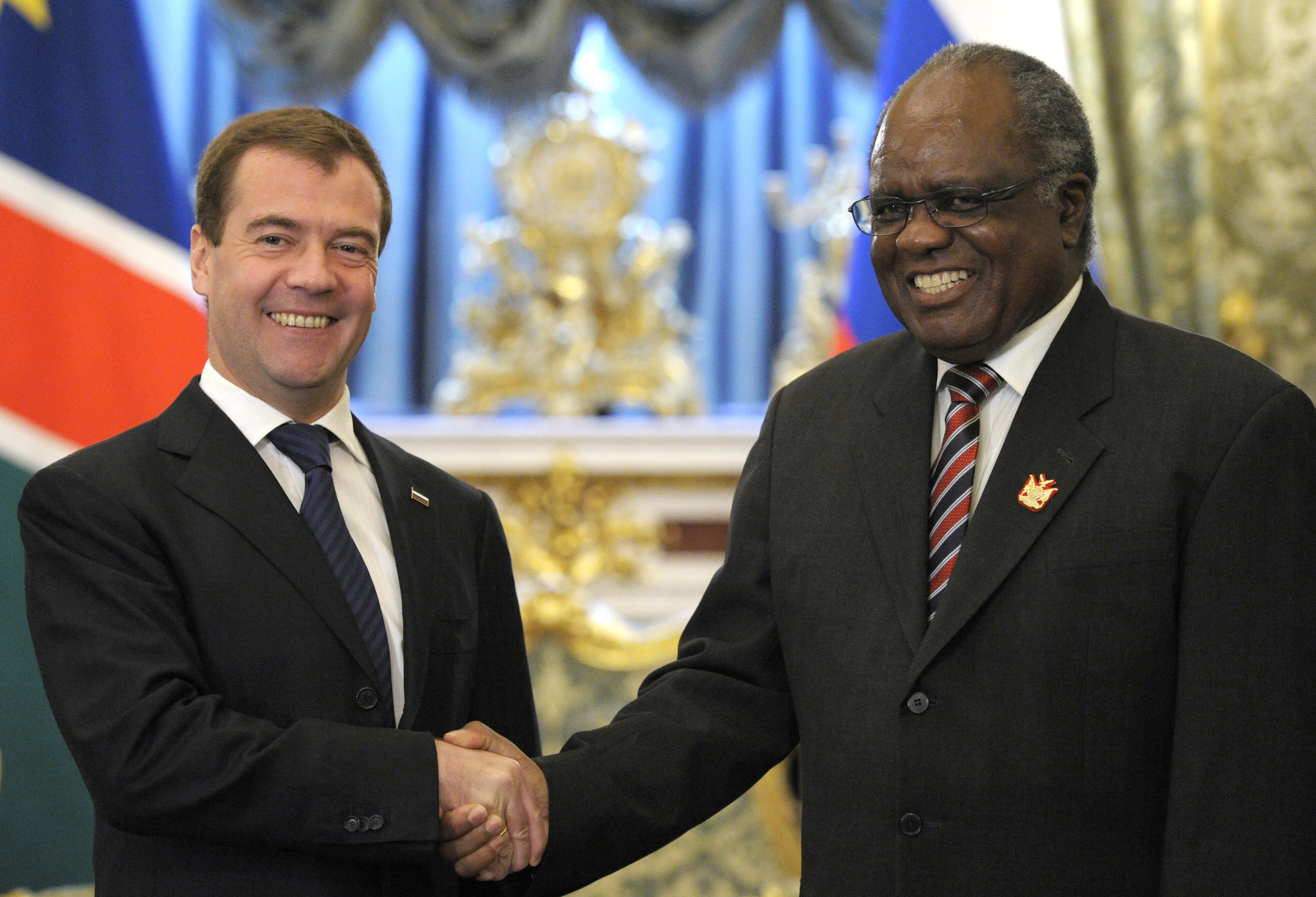 Russian President Dmitry Medvedev, left, and Namibian President Hifikepunye Pohamba shake hands prior their talks in Moscow's Kremlin, Russia, Thursday, May 20, 2010. Russia is returning on the African continent as its close partner after a break due to our internal difficulties_Medvedev said at the talks with Namibian President Hifikepynye Lucas Pohamba on Thursday. (AP Photo/Alexander Zemlianichenko, pool)