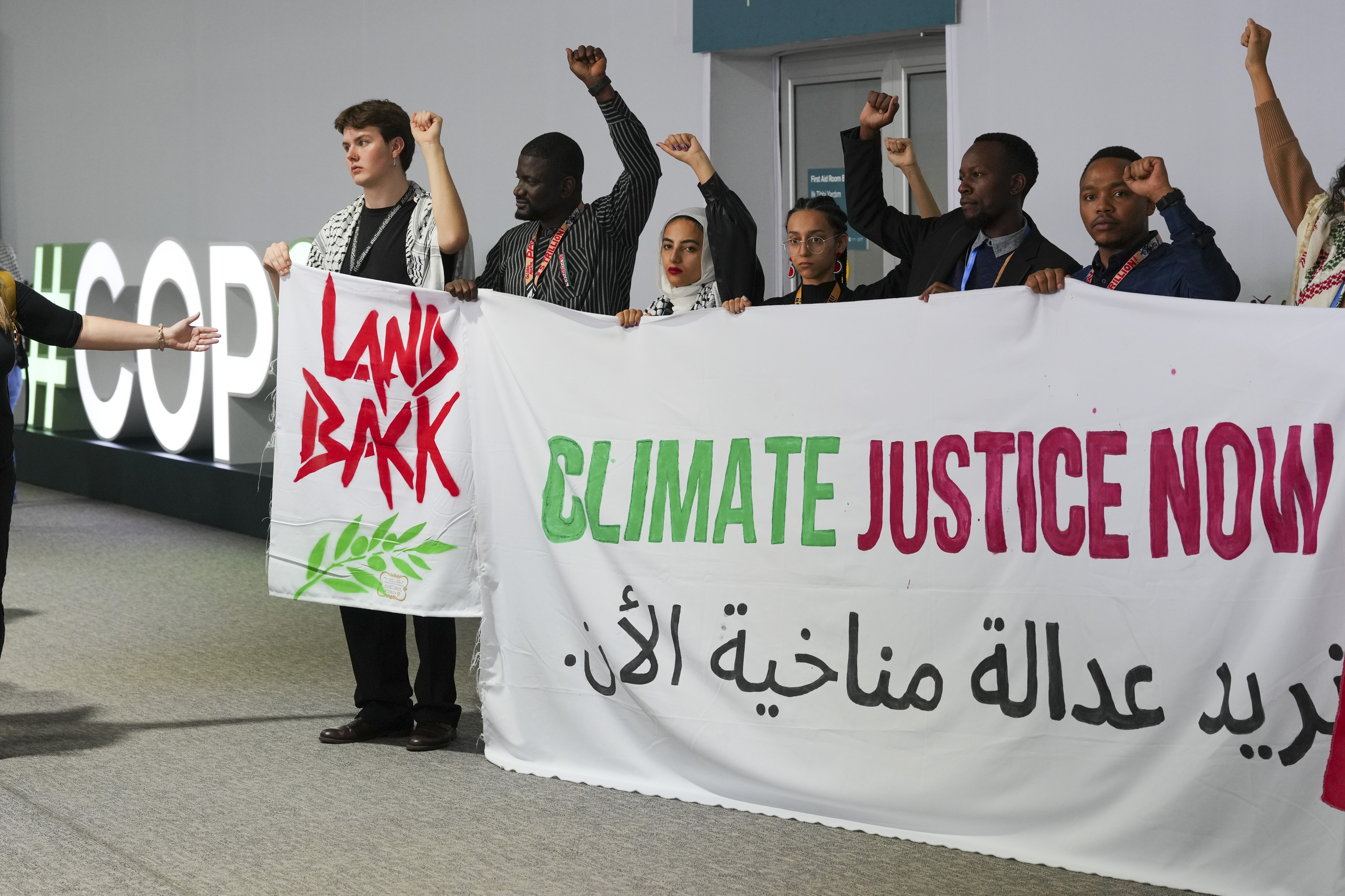 Activists demonstrate for climate justice and a ceasefire between Israel and Hamas at the COP29 United Nations Climate Summit, in Baku, Azerbaijan [Peter Dejong/AP]