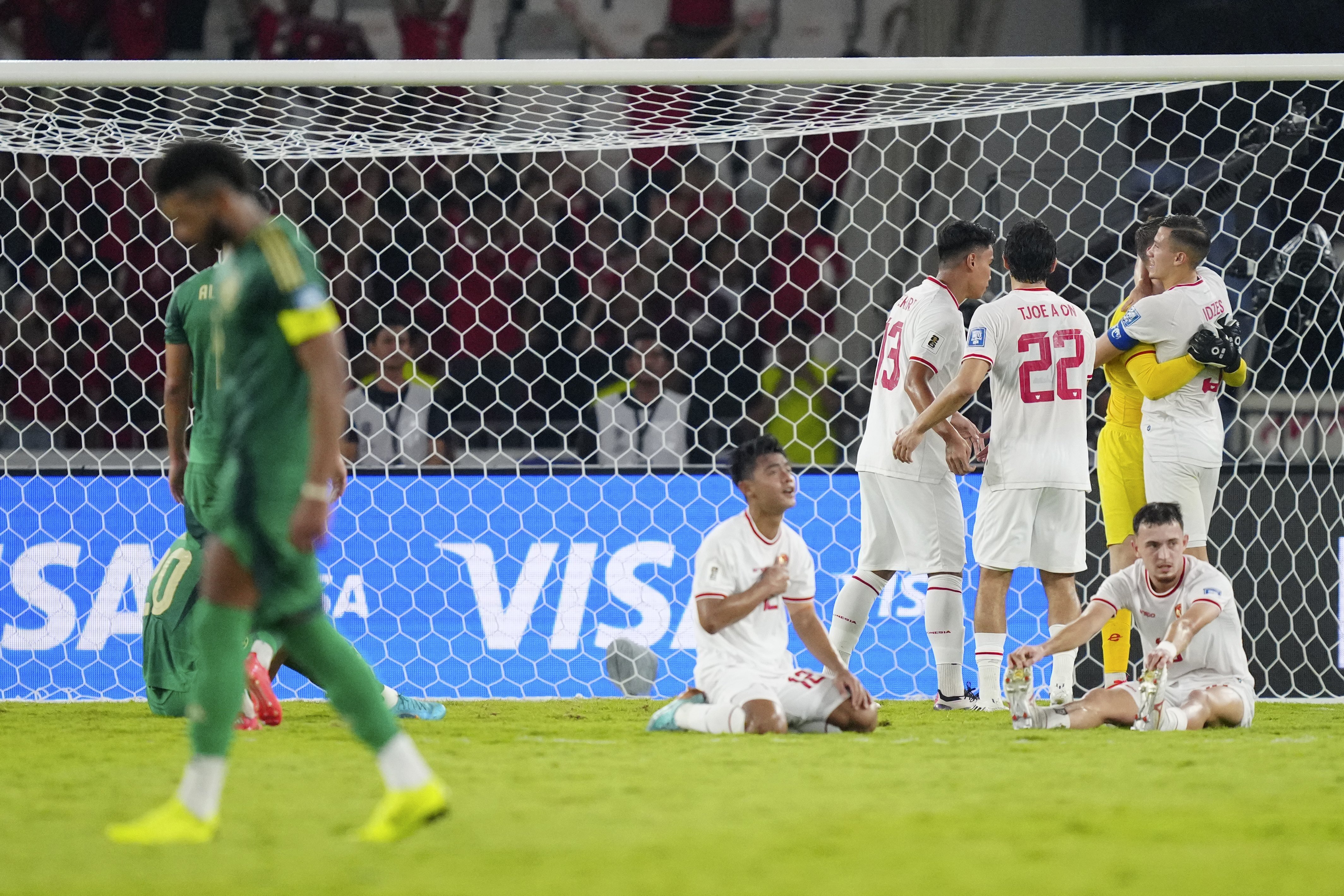 Indonesian players celebrate after winning the 2026 World Cup Asian 3rd round qualifier soccer match between Indonesia and Saudi Arabia at Gelora Bung Karno Main Stadium in Jakarta, Indonesia, Tuesday, Nov. 19, 2024. (AP Photo/Tatan Syuflana)