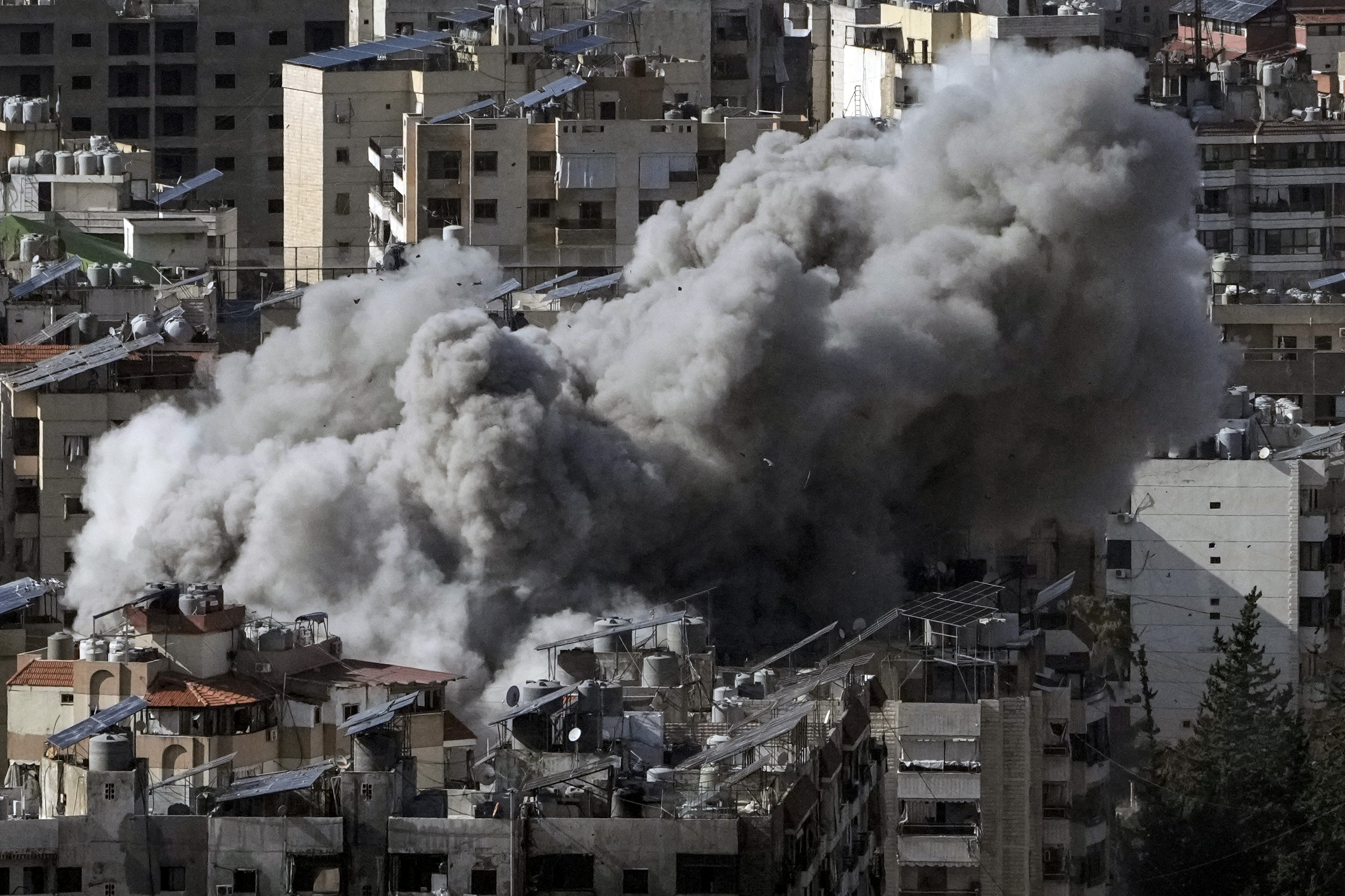 Smoke rises after an Israeli airstrike on Dahiyeh