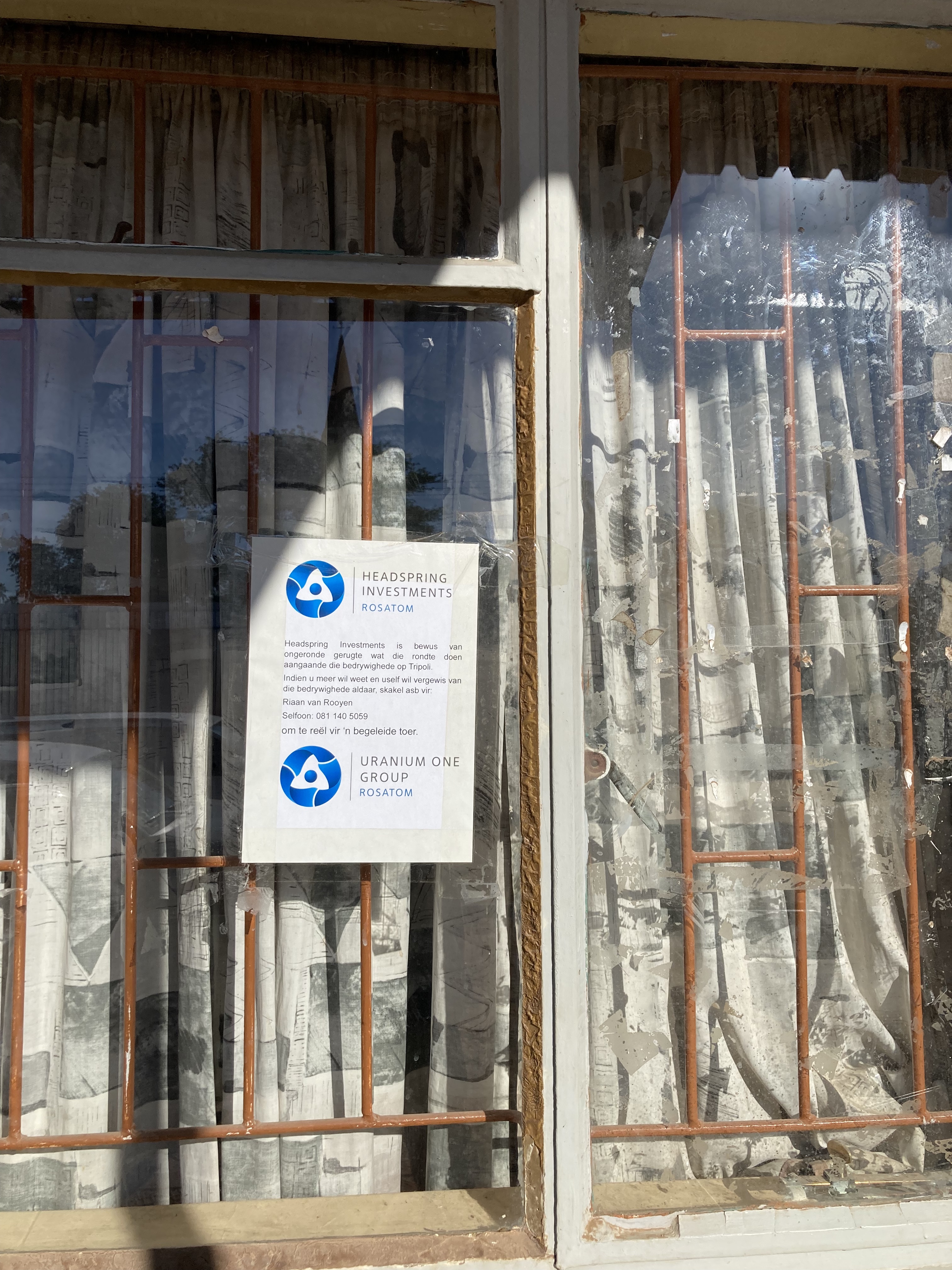 A shop window in Leonardville, Namibia, with a Rosatom poster pasted on its window [Tom Brown/Al Jazeera]