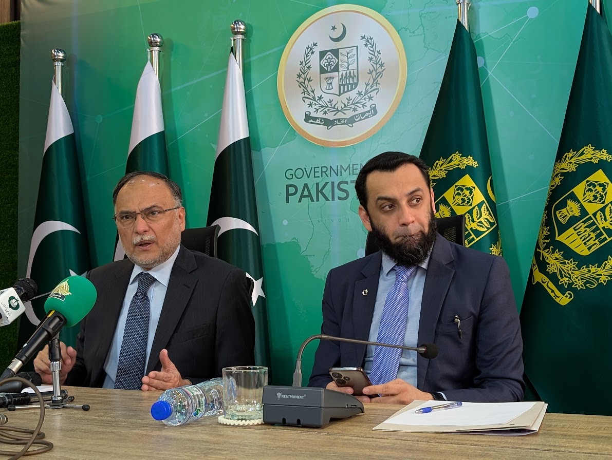 Federal ministers Ahsan Iqbal, left, and Attaullah Tarar speak to the media in Islamabad on November 28, 2024 [Abid Hussain/Al Jazeera]