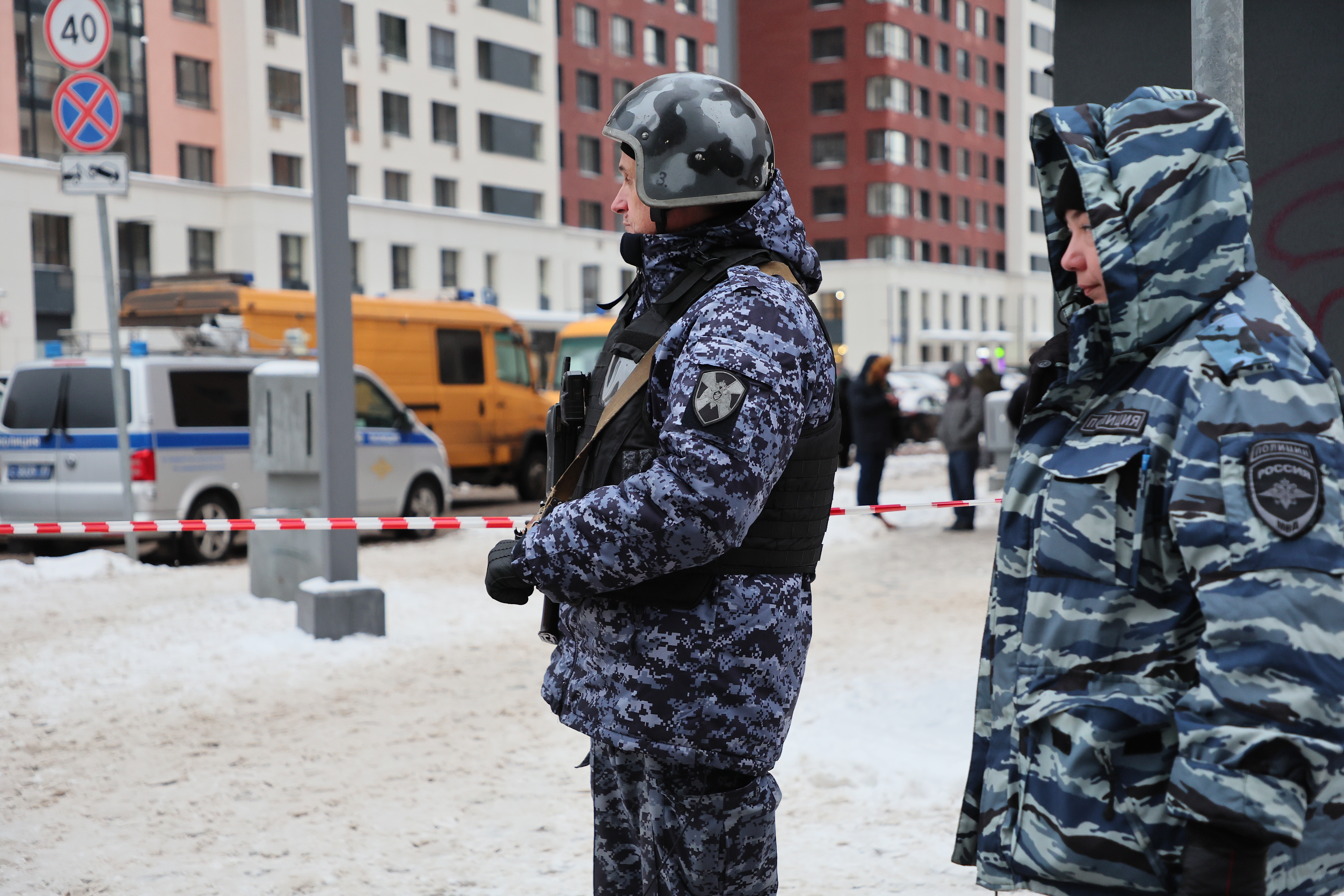 Police officers stand guard near a scene of an explosion in Moscow,