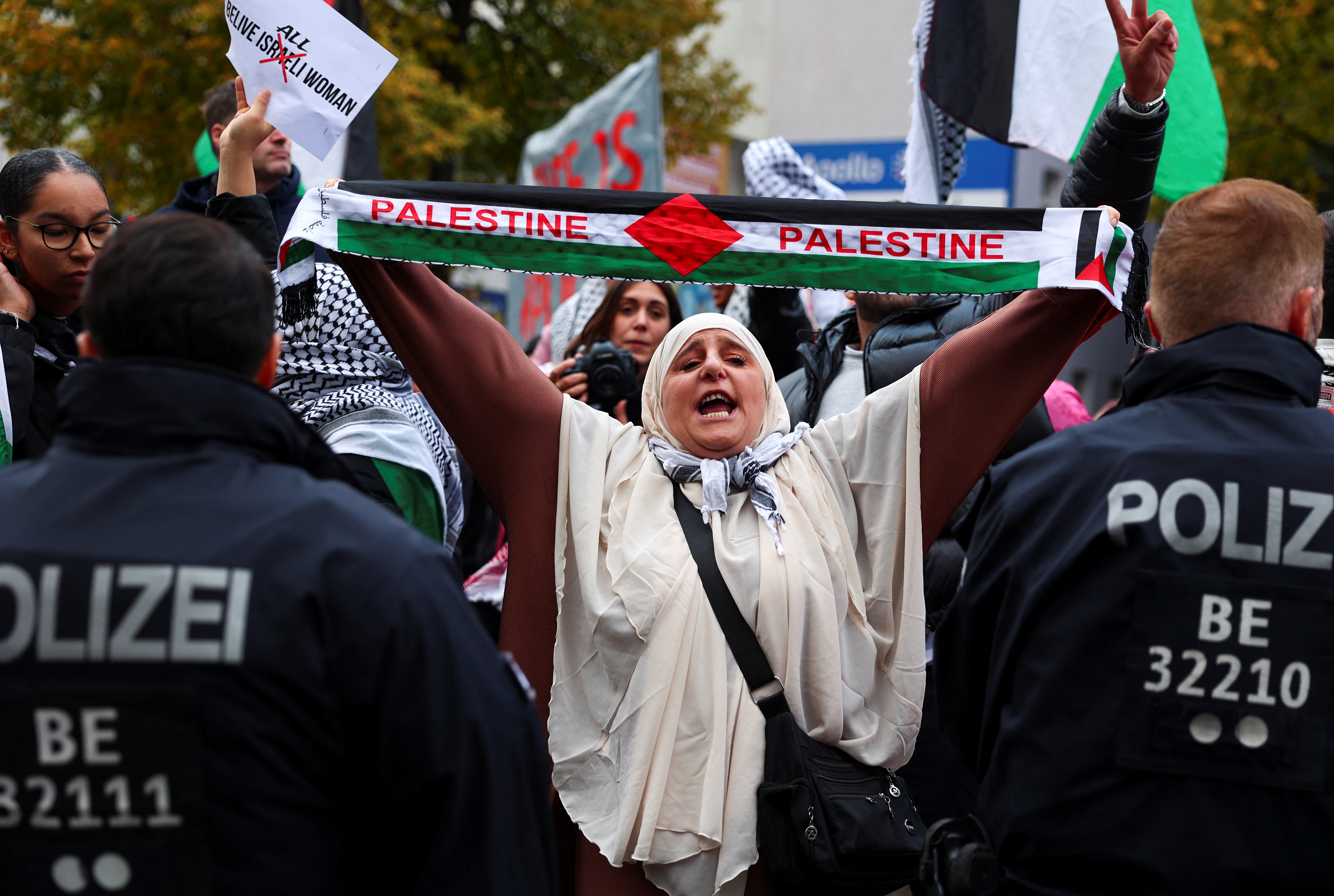 A woman reacts during a demonstration in solidarity with Palestinians in Gaza, ahead of the October 7 attack anniversary, amid the Israel-Hamas conflict, in Berlin, Germany, October 5, 2024. REUTERS/Christian Mang
