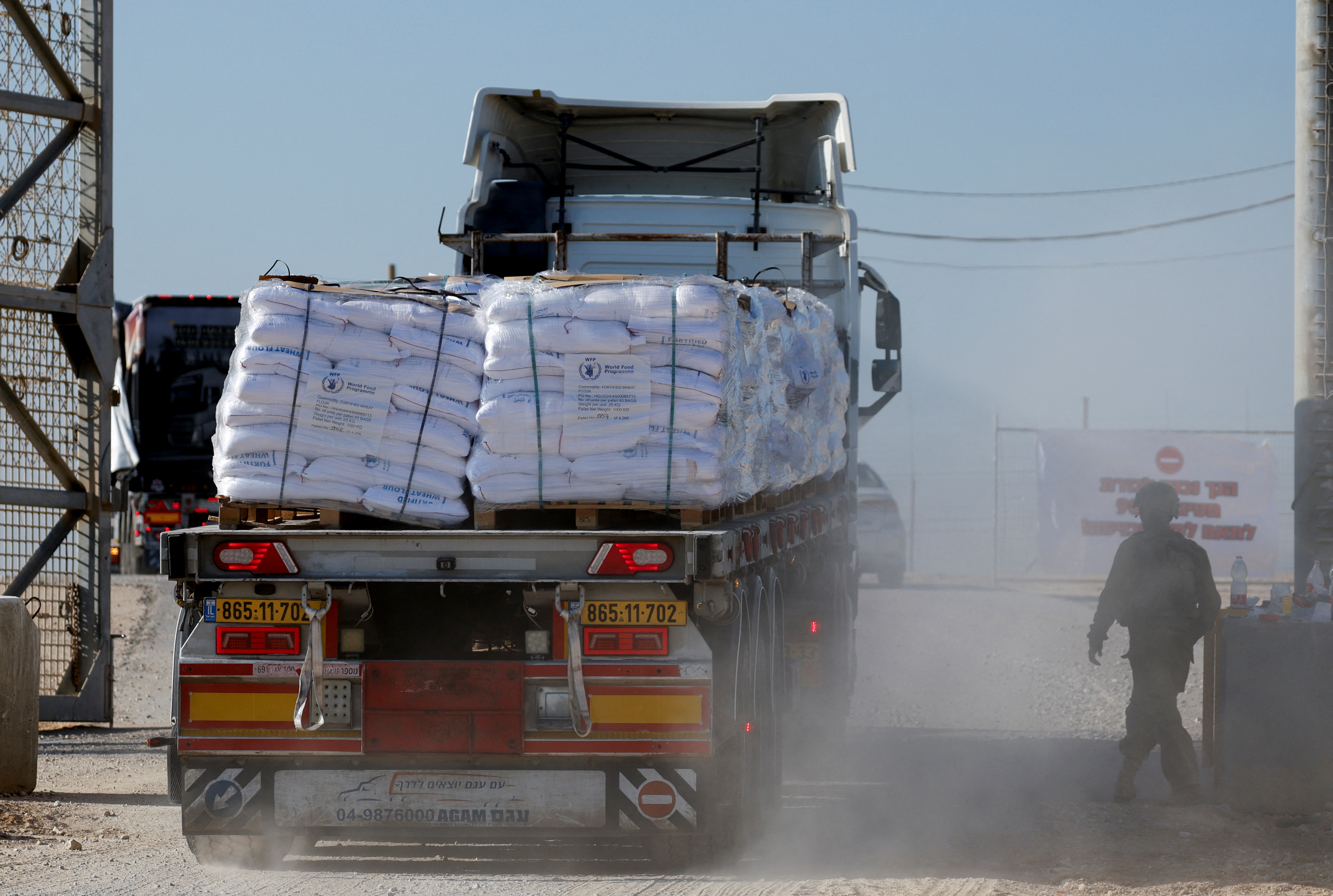 A truck carries humanitarian aid destined for the Gaza Strip, amid the ongoing conflict in Gaza between Israel and Hamas, at the Kerem Shalom crossing in southern Israel, November 11, 2024.
