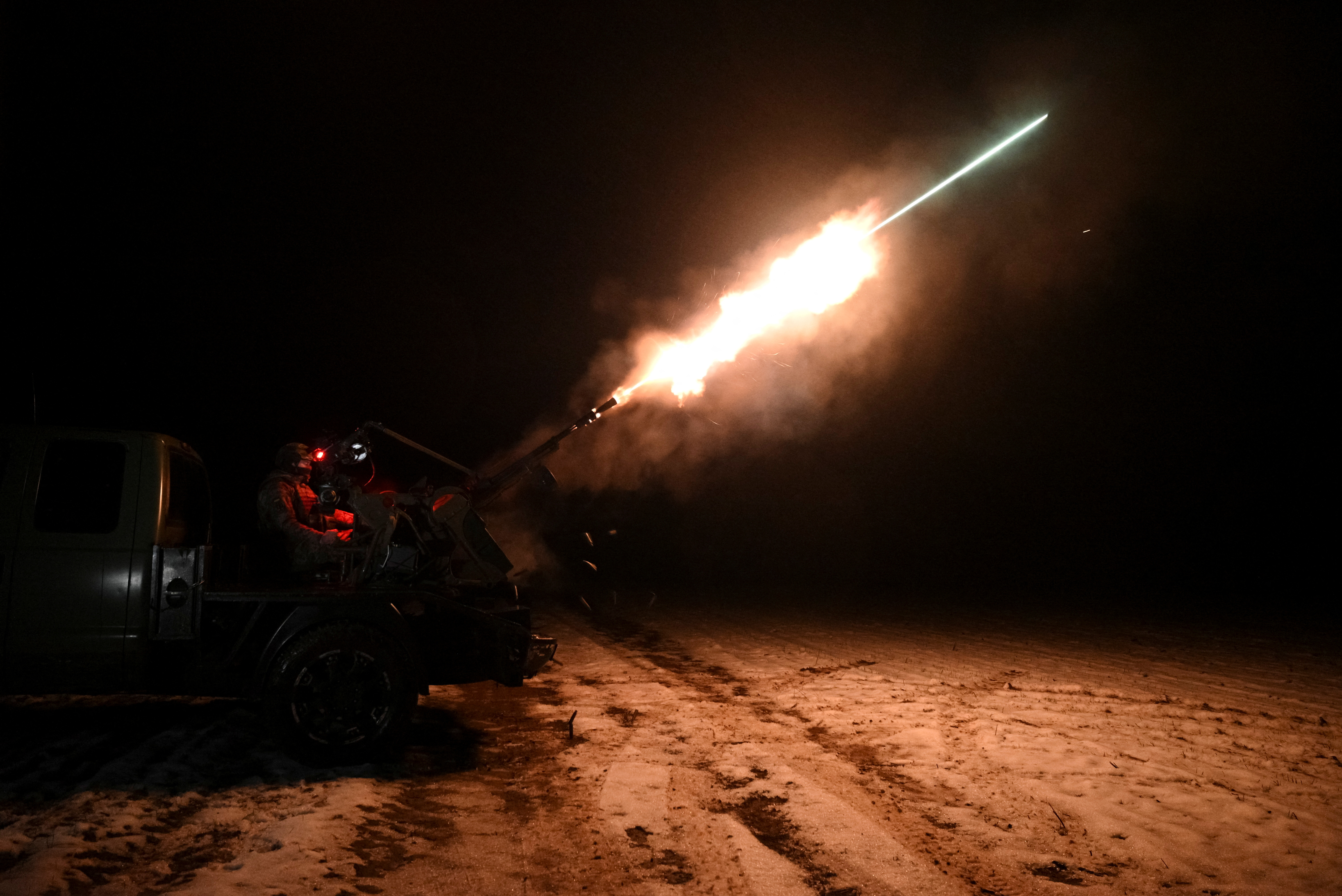 A Ukrainian serviceman from an anti-drone mobile air defence unit fires a ZU-23-2 anti-aircraft cannon during combat, amid Russia's attack on Ukraine, in Chernihiv region, Ukraine December 2