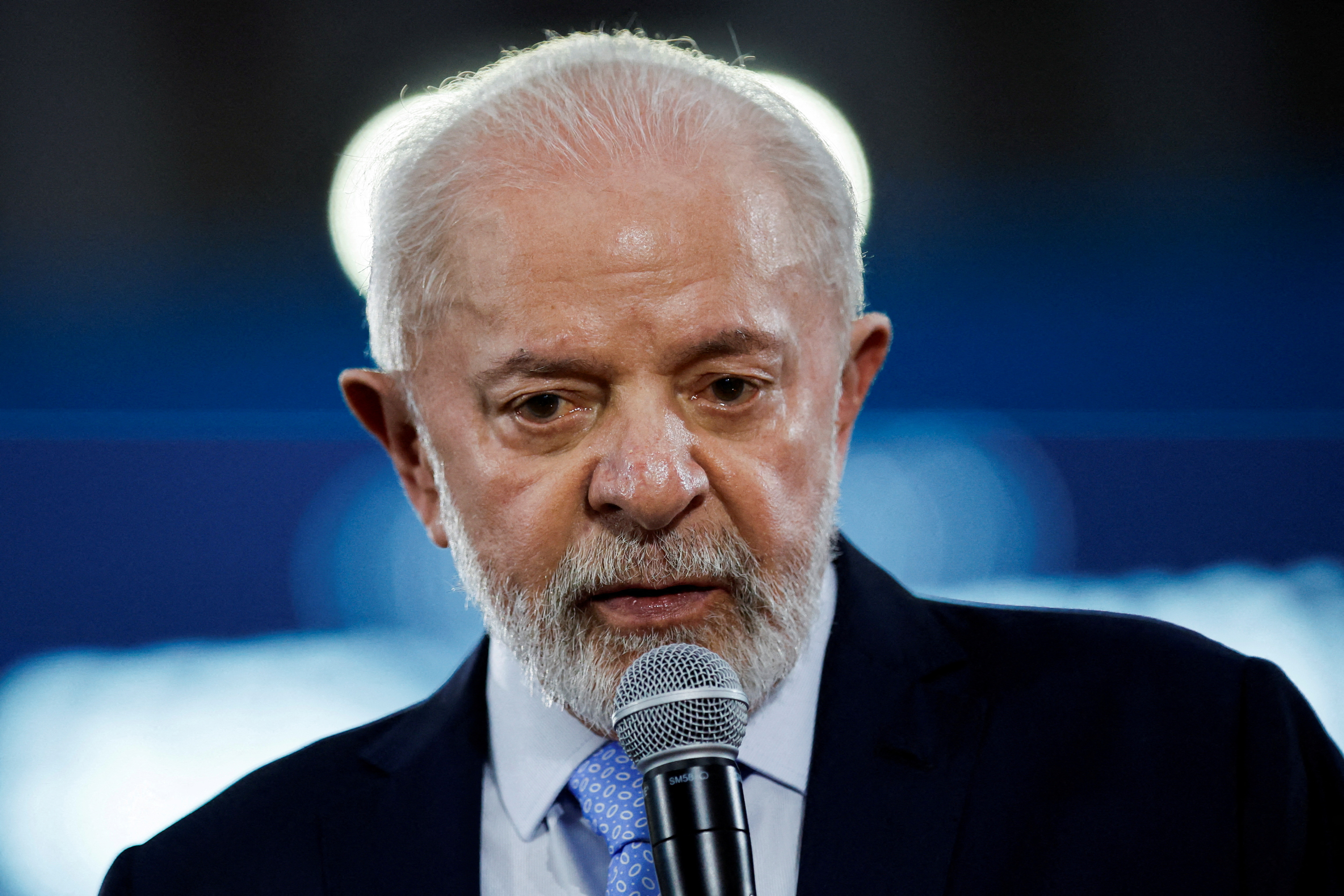 Brazilian President Luiz Inacio Lula da Silva speaks into a microphone