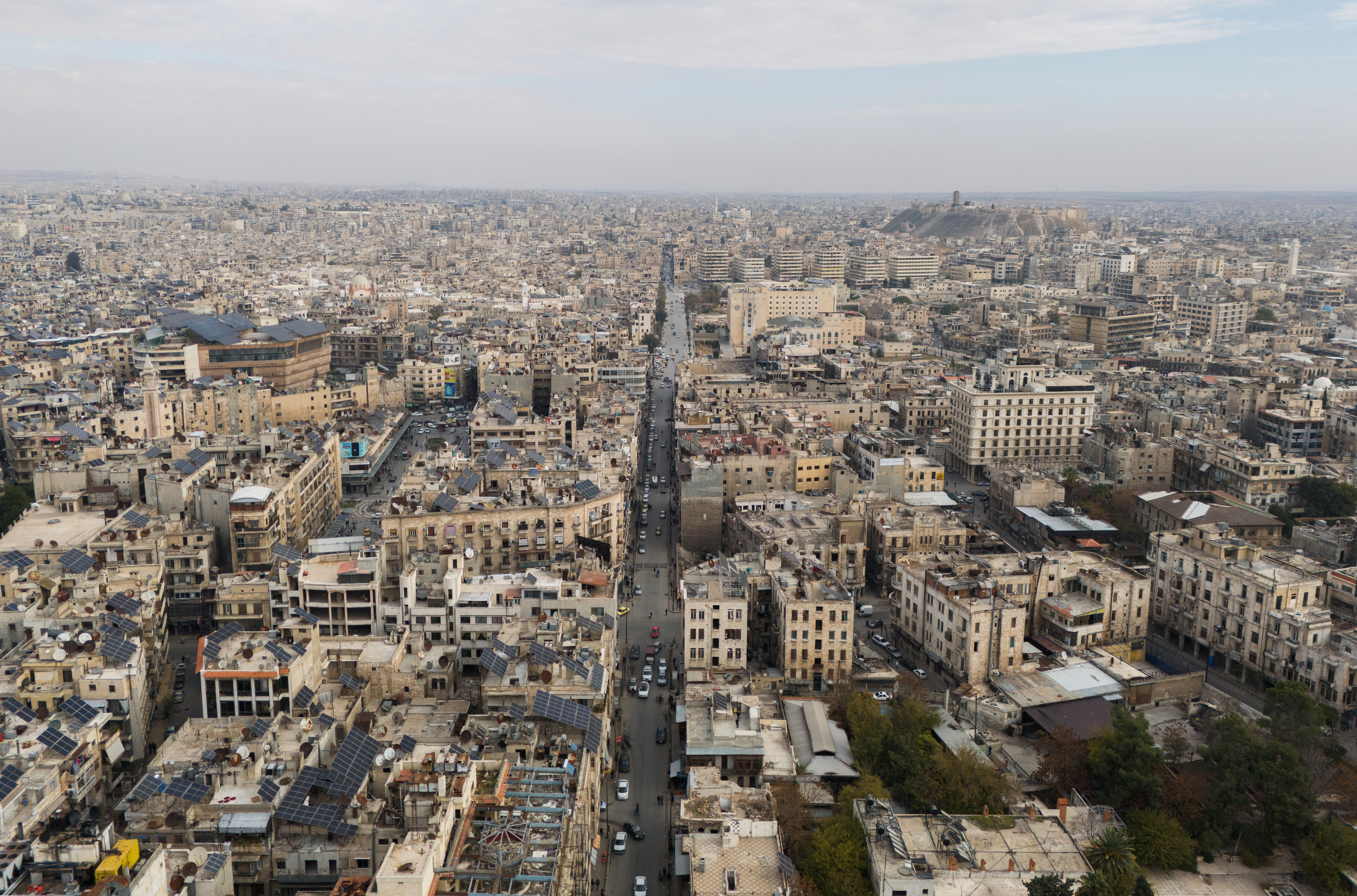 A drone view shows buildings and the ancient citadel