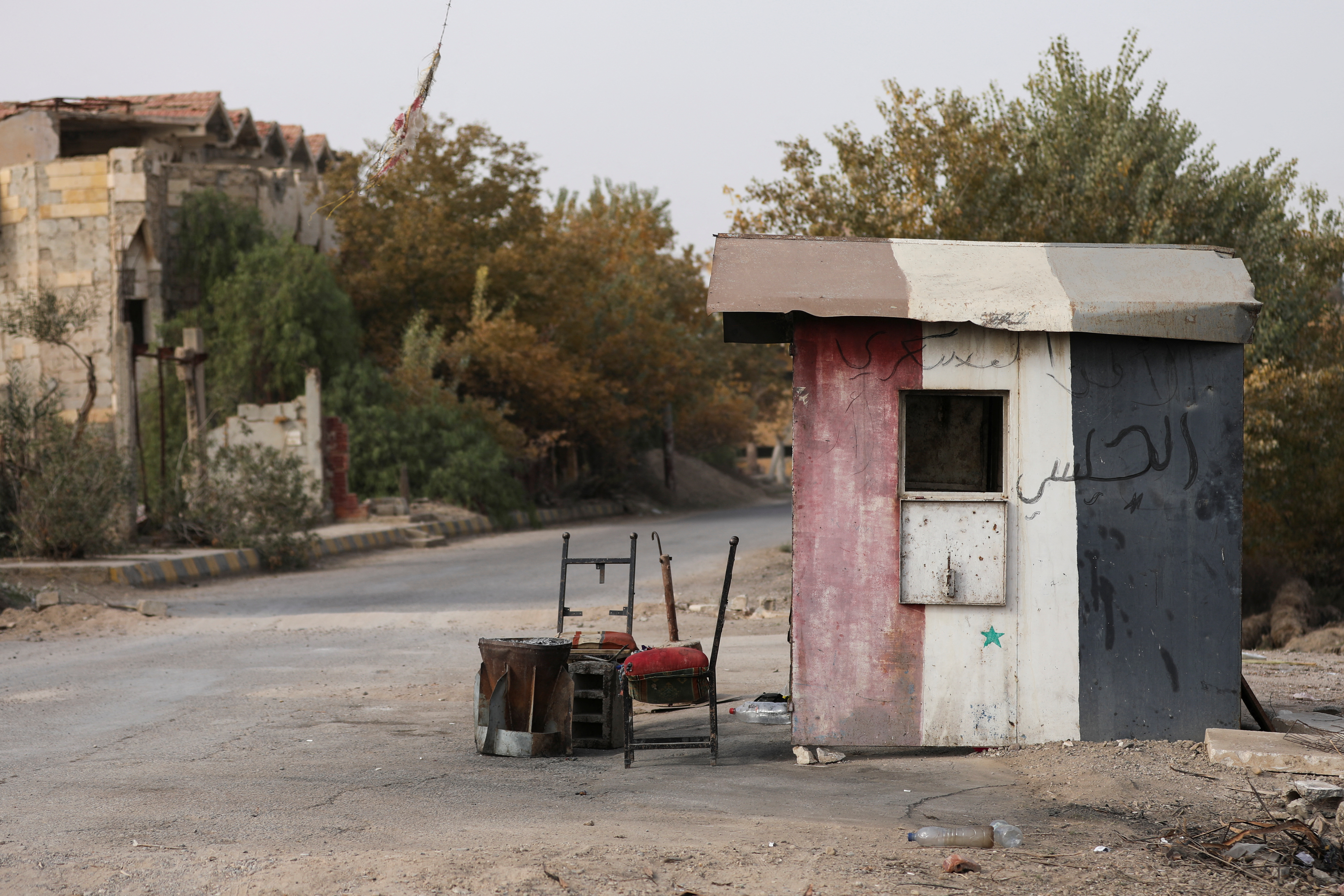 Damaged chairs lie at a checkpoint that belonged to forces loyal to Bashar al-Assad government in Deir al-Zor, after U.S.-backed alliance led by Syrian Kurdish fighters captured Deir el-Zor, the government's main foothold in the vast desert, according to Syrian sources, in Syria December 7, 2024. REUTERS/Orhan Qereman