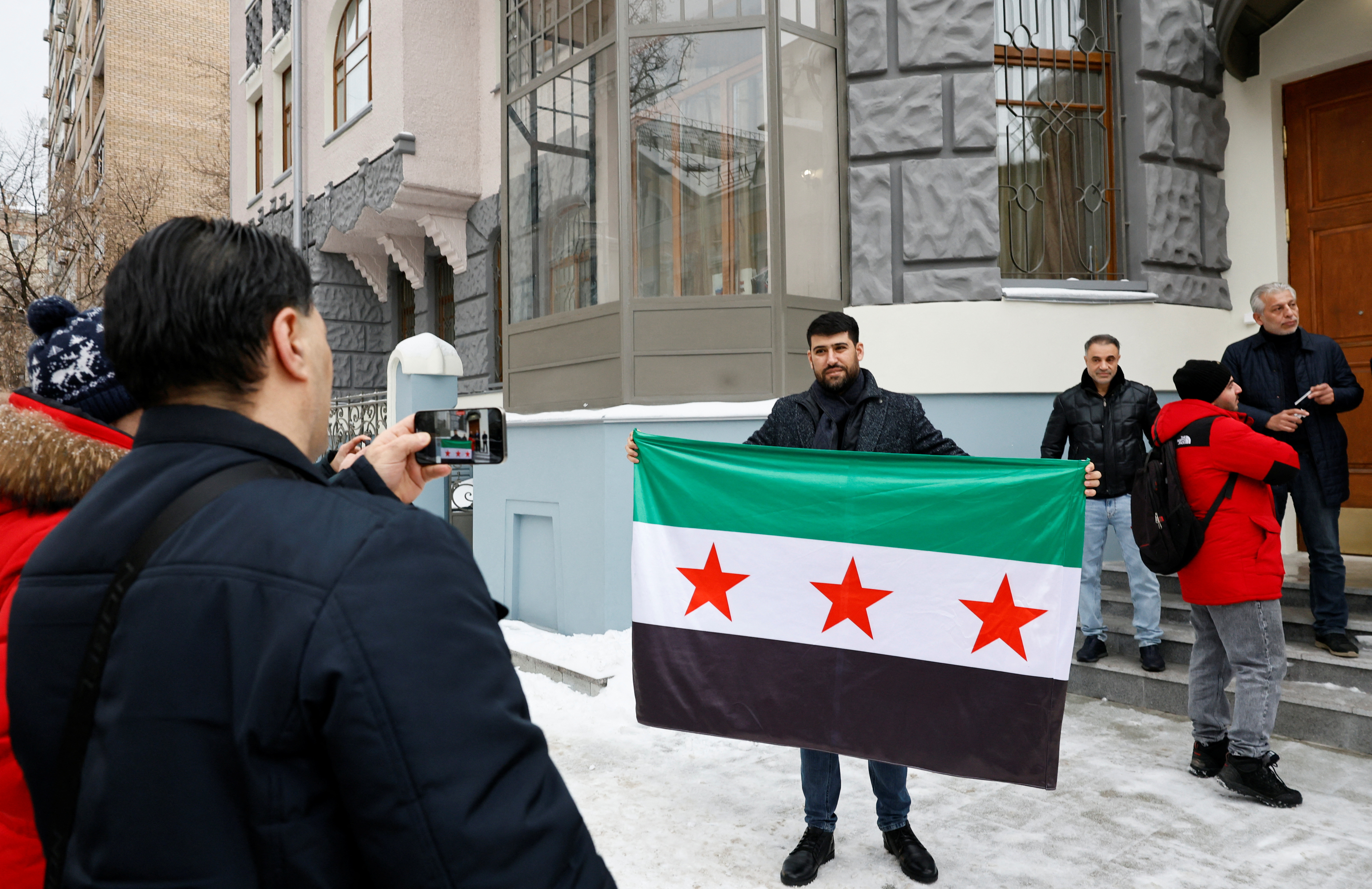 Images with the Syrian opposition flag raised at the embassy in Moscow