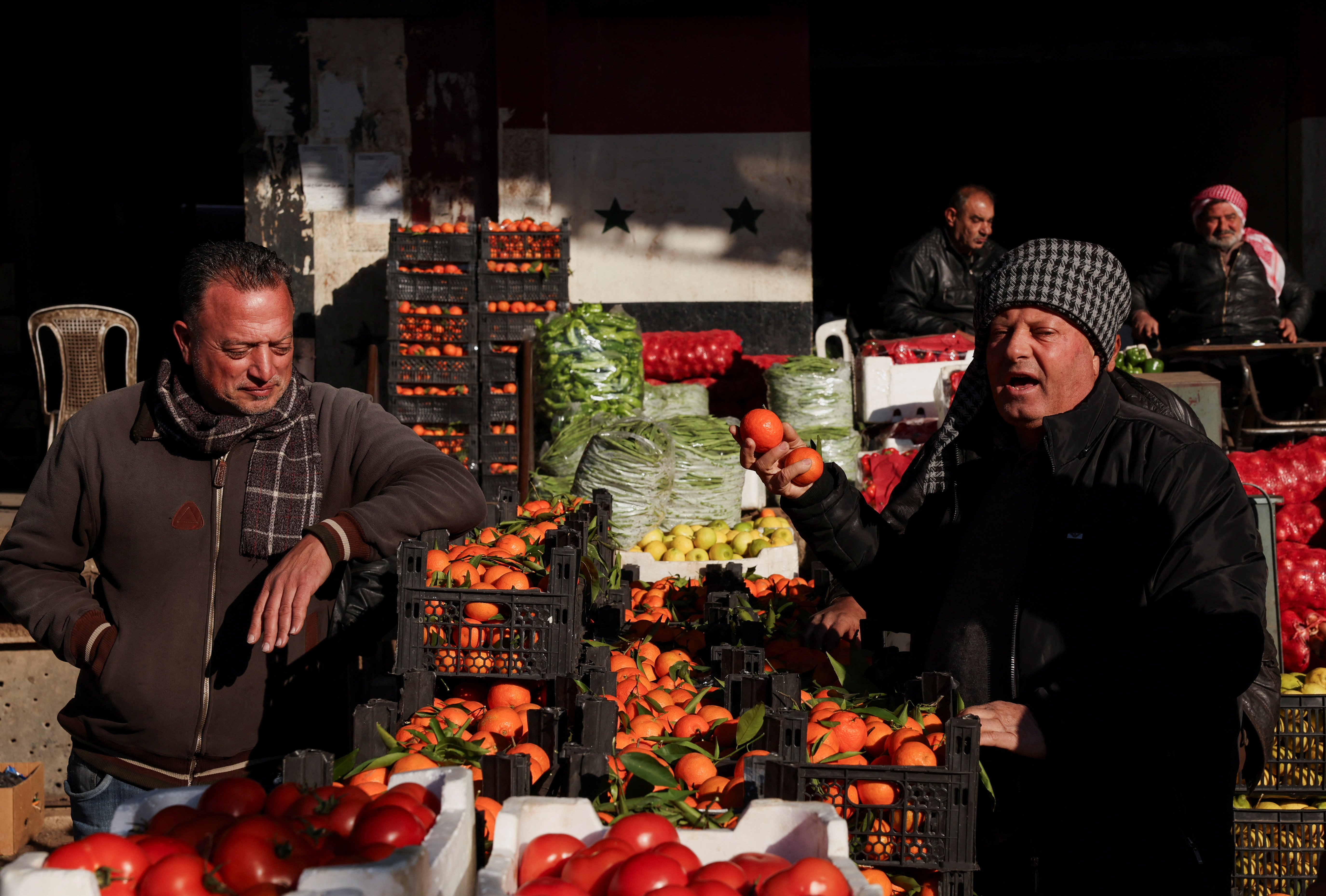 People sell produce at a market, after the ousting of Syria's Bashar al-Assad, [File: Amr Abdallah Dalsh/Reuters]