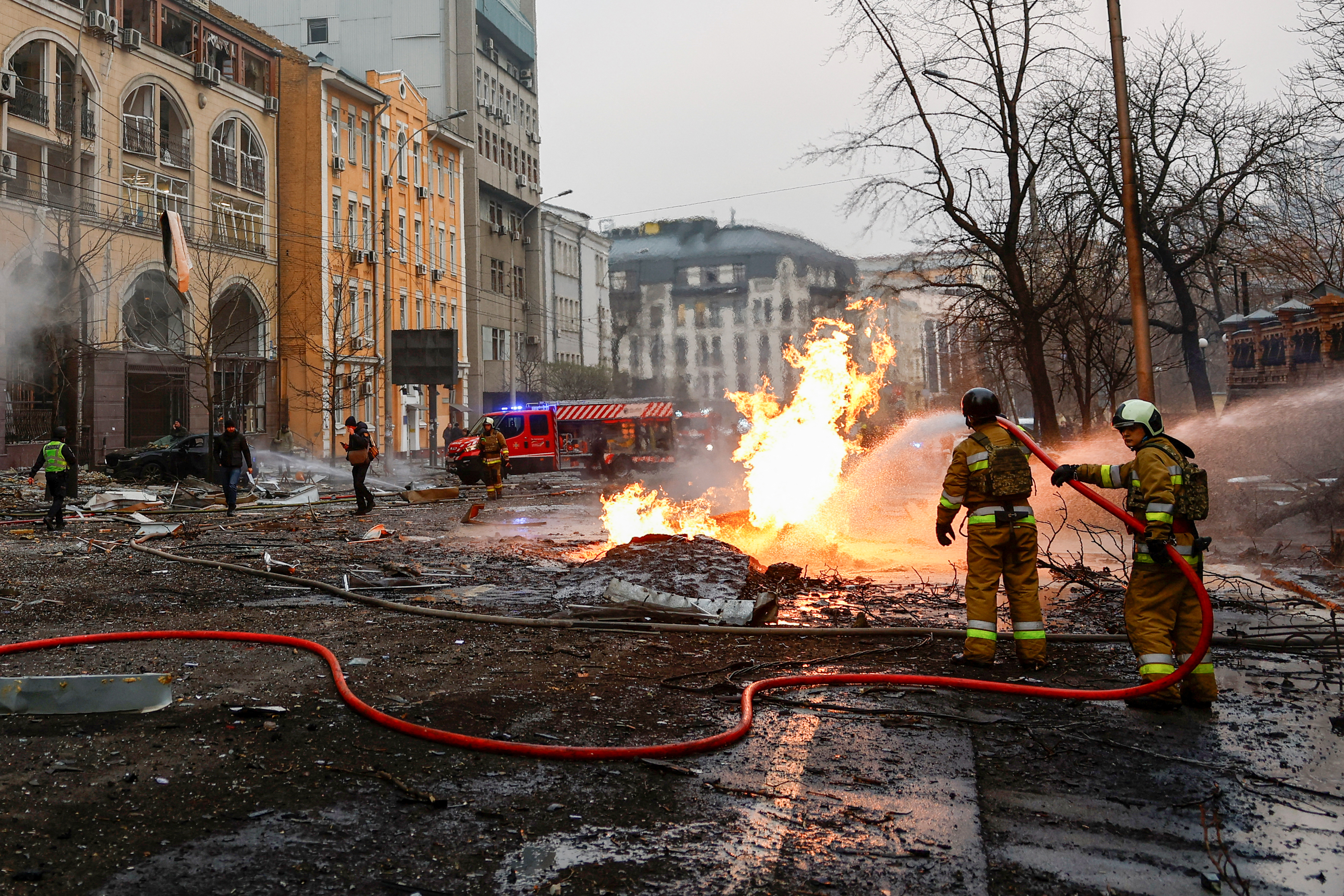 Rescuers work at the site of a building destroyed during a Russian missile strike, amid Russia's attack on Ukraine