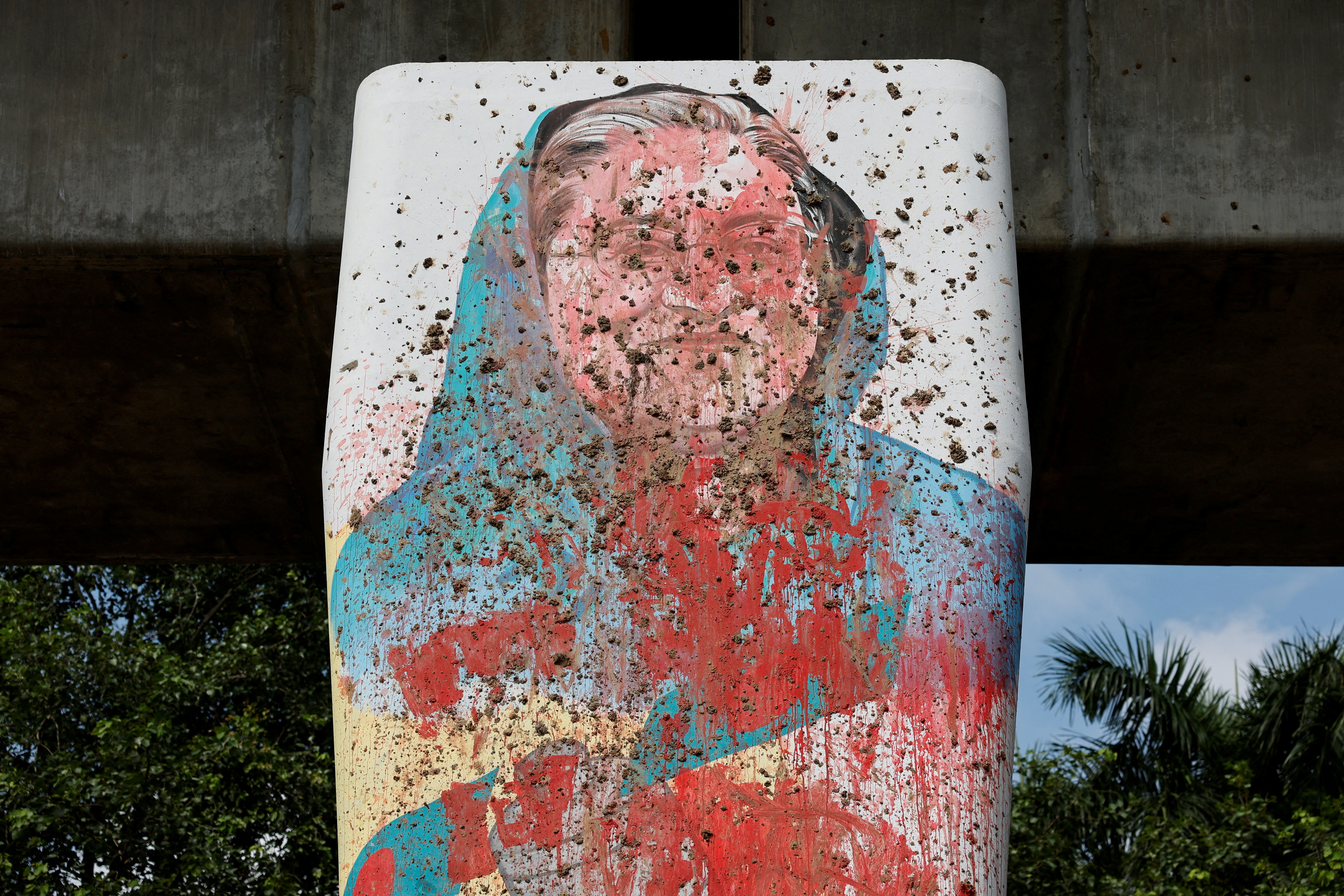 A mural of Bangladeshi Ex Prime Minister Sheikh Hasina is seen vandalised by protesters days before in Dhaka, Bangladesh