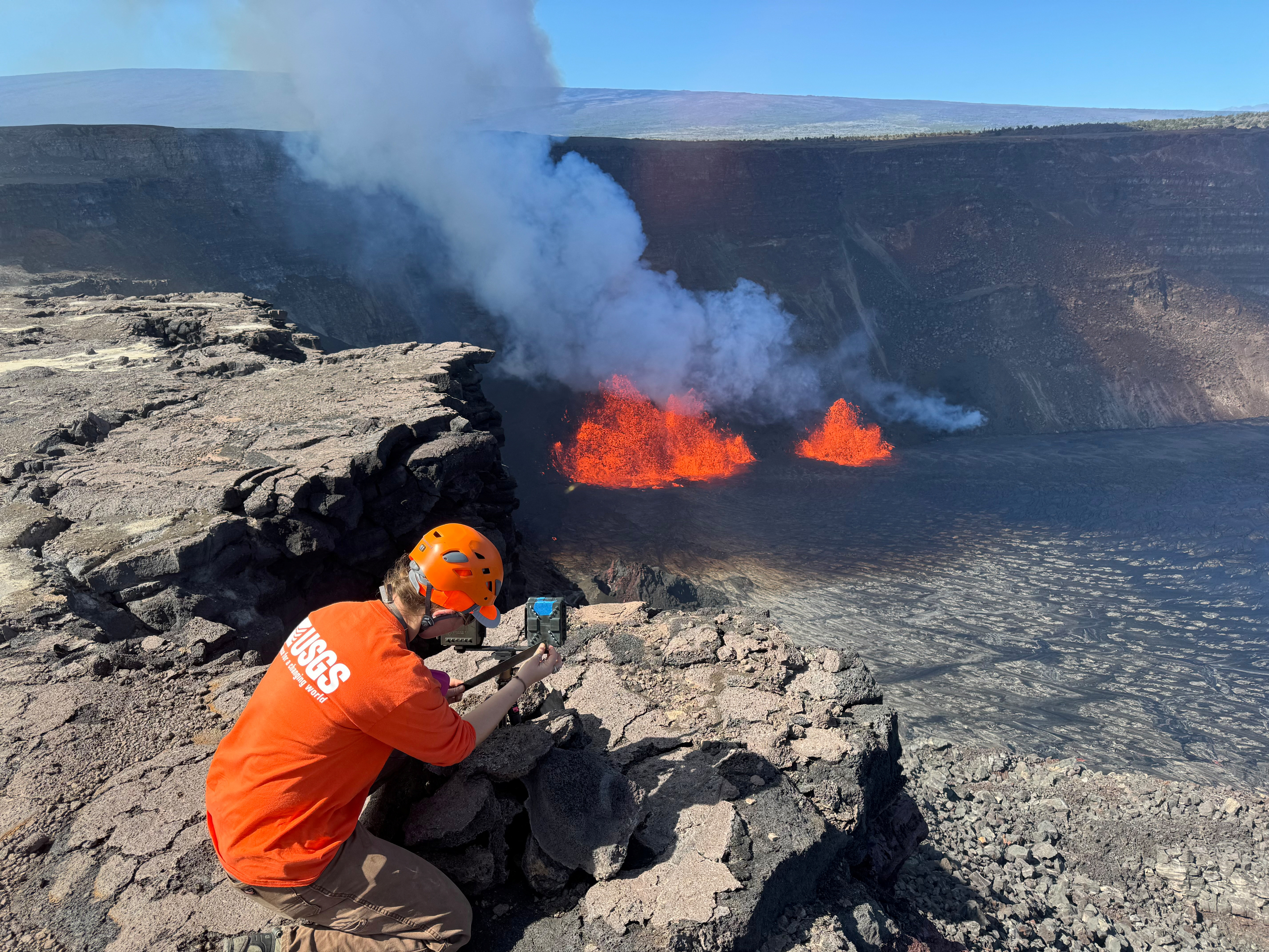 A geologist observes the Kilauea volcano eruption on Hawaii