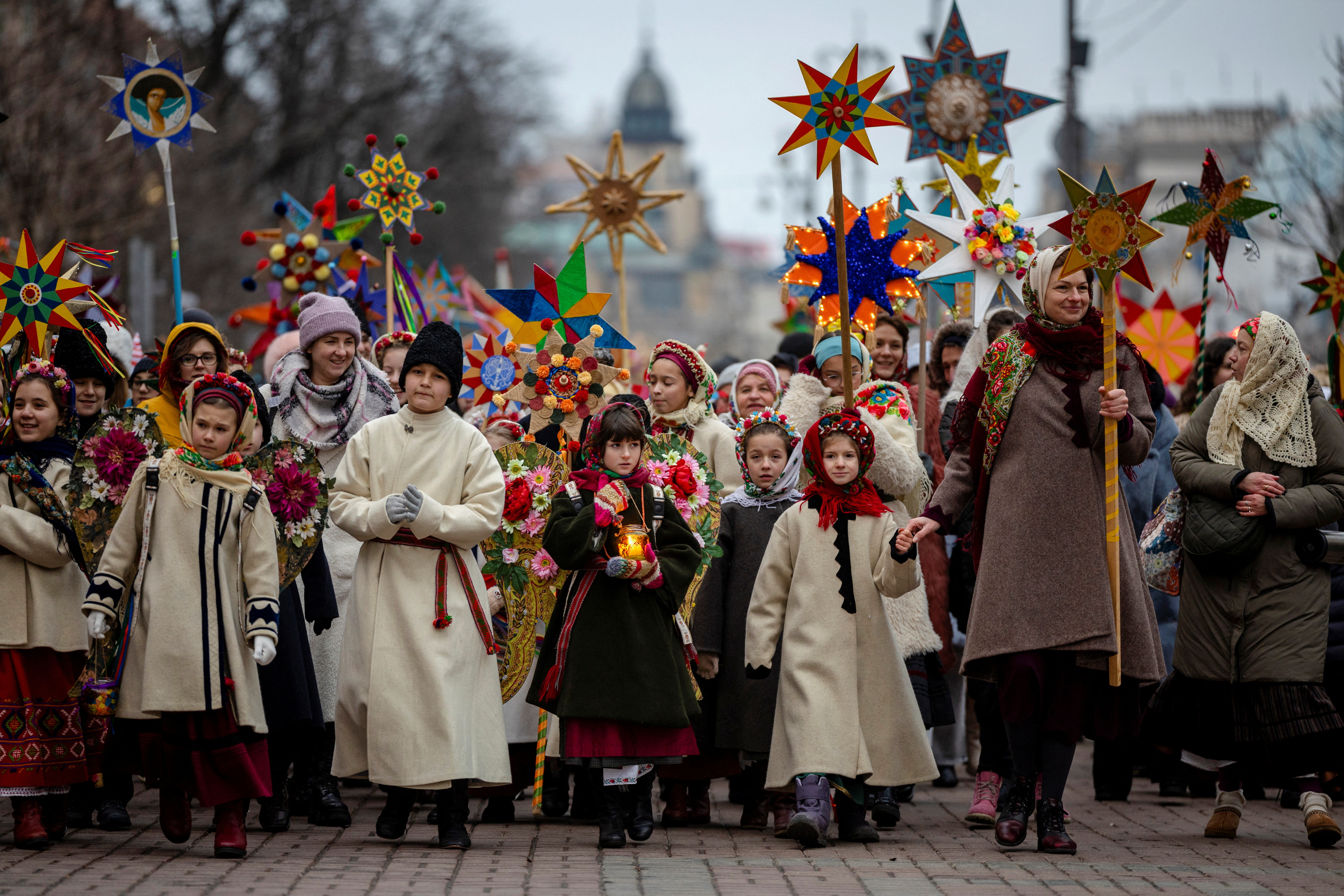 People wear traditional Ukrainian clothes as they mark Christmas Day with a carol singing event, amid Russia's attack on Ukraine, in Kyiv, Ukraine, December 25
