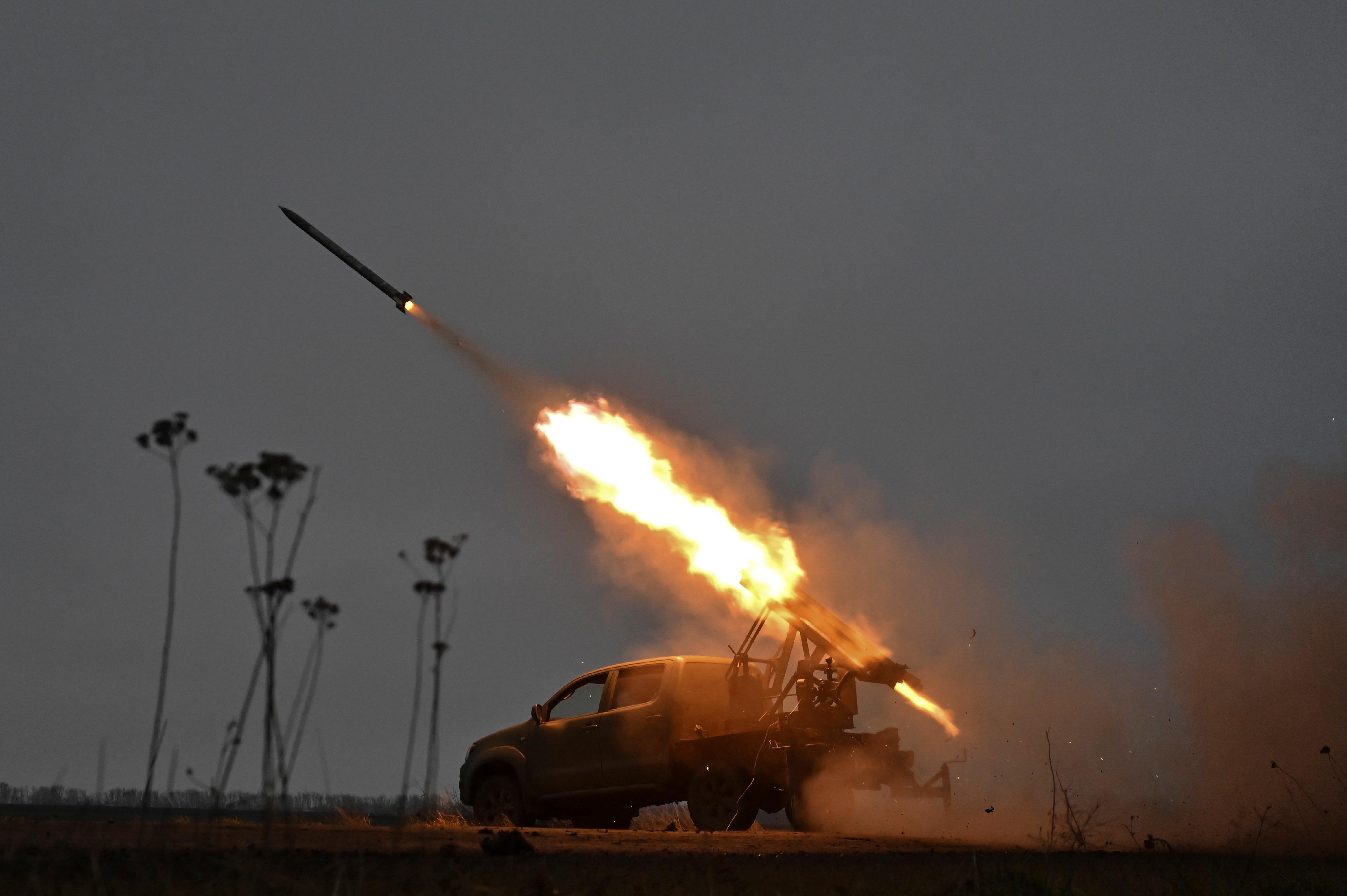 Zaporizhzhia region police fire a small multiple launch rocket system (MLRS) towards Russian troops