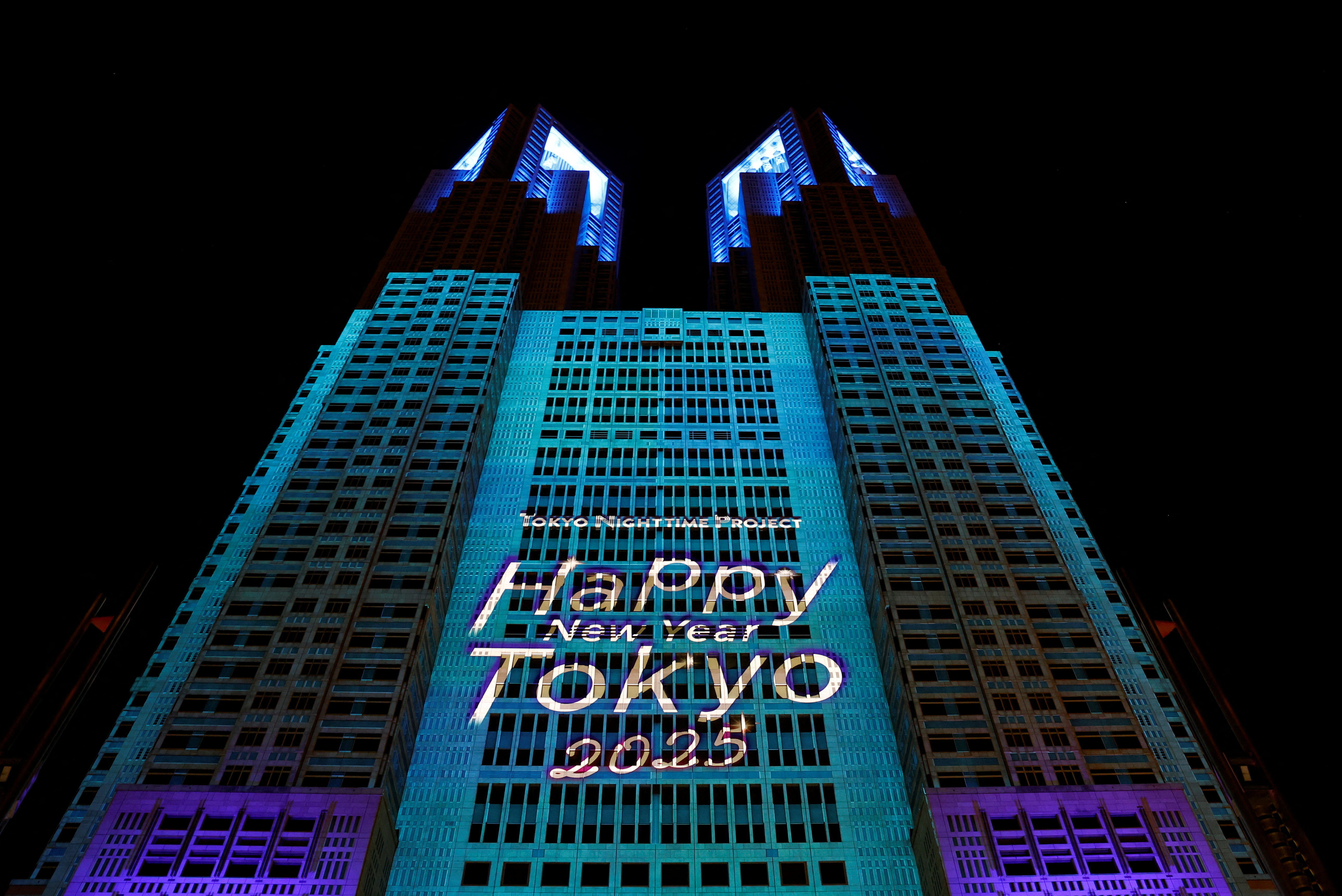 A projection mapping is displayed on the surface of the Tokyo Metropolitan Government building, on New Year's Eve, in Tokyo, Japan December 31