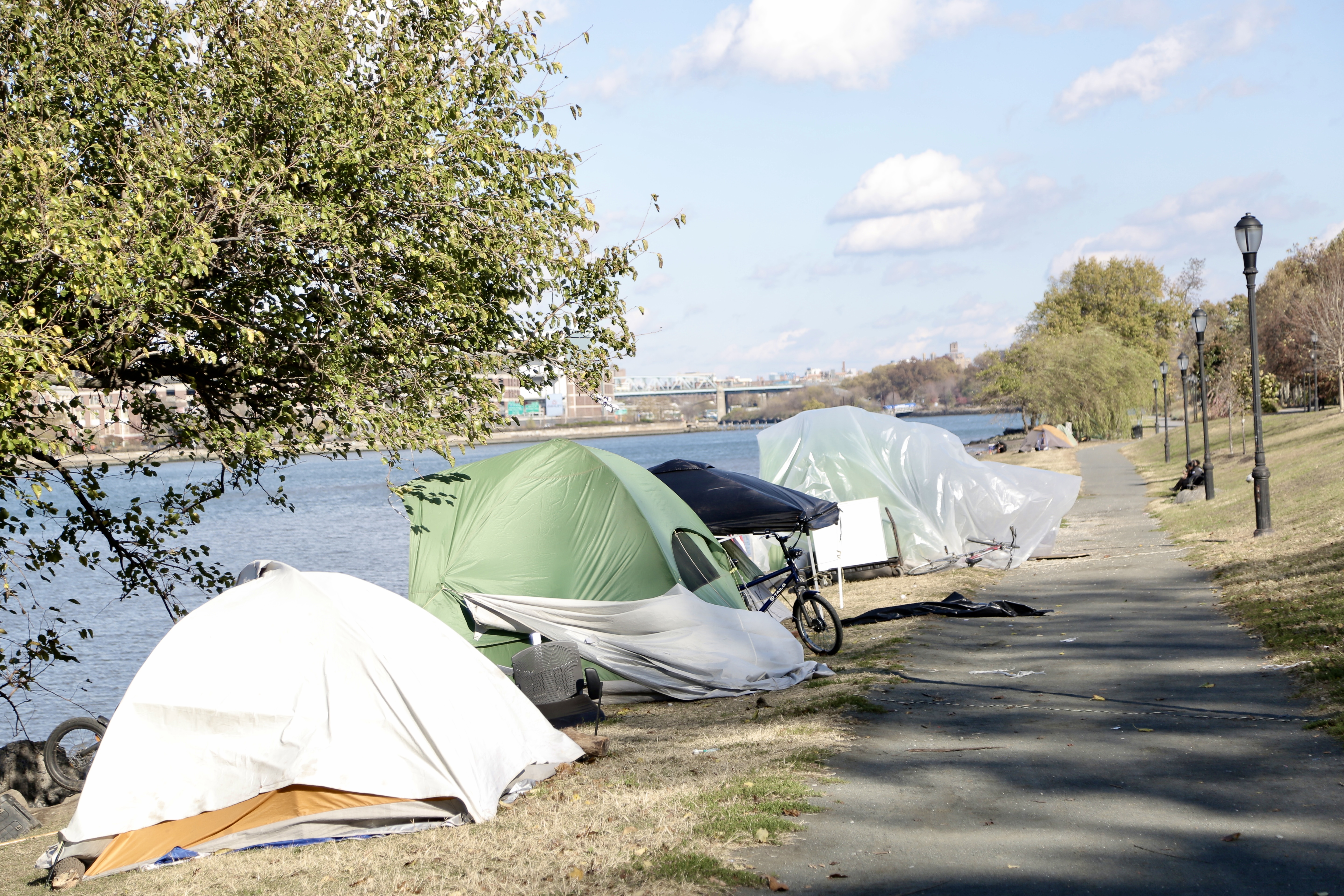 Tents line the riverbank at Randall's Island Humanitarian Emergency Response and Relief Center.