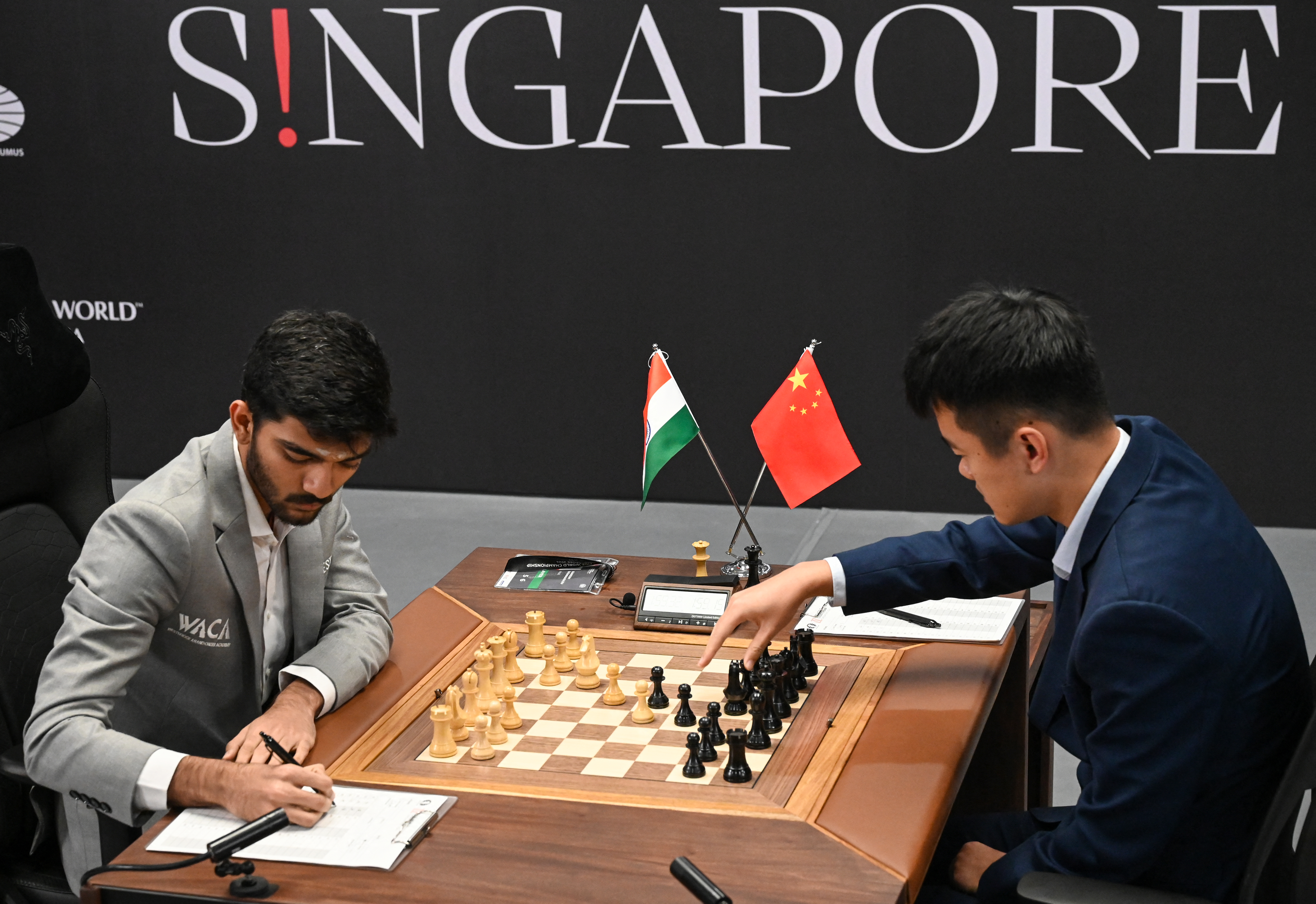 Chess players Ding Liren and Gukesh Dommaraju.