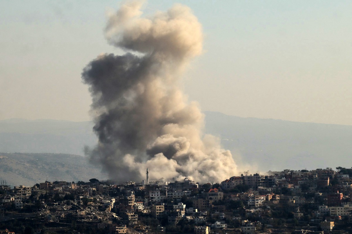 thick smoke rises from explosions as Israeli forces reportedly demolish dwellings in the border town of Khiam in southern Lebanon, on December 1, 2024