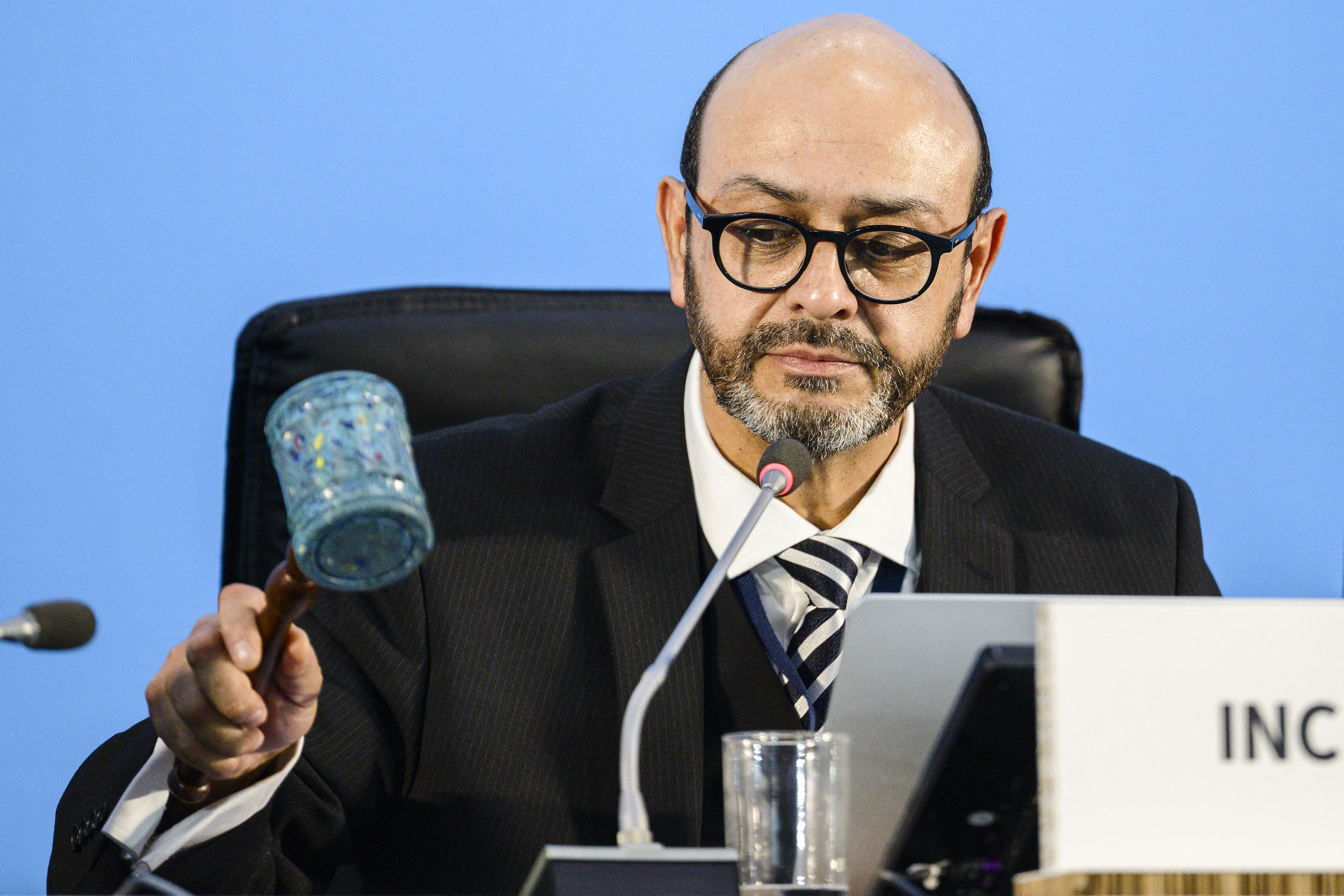 INC-5 Chair Luis Vayas Valdivieso brings down a gavel, made with recycled plastic bottle tops from the Dandora landfill in Nairobi, to mark an agreement that talks will resume at a later date, during an open plenary of the fifth session of the UN Intergovernmental Negotiating Committee on Plastic Pollution (INC-5) in Busan, early on December 2, 2024. - Negotiators have failed to reach agreement on a landmark treaty to curb plastic pollution and need more time to continue discussions, the diplomat chairing the talks in South Korea said on December 1, 2024. [Anthony Wallac/ AFP]