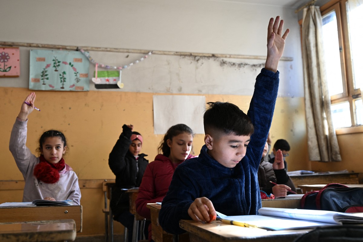 Syrian schoolchildren attend class
