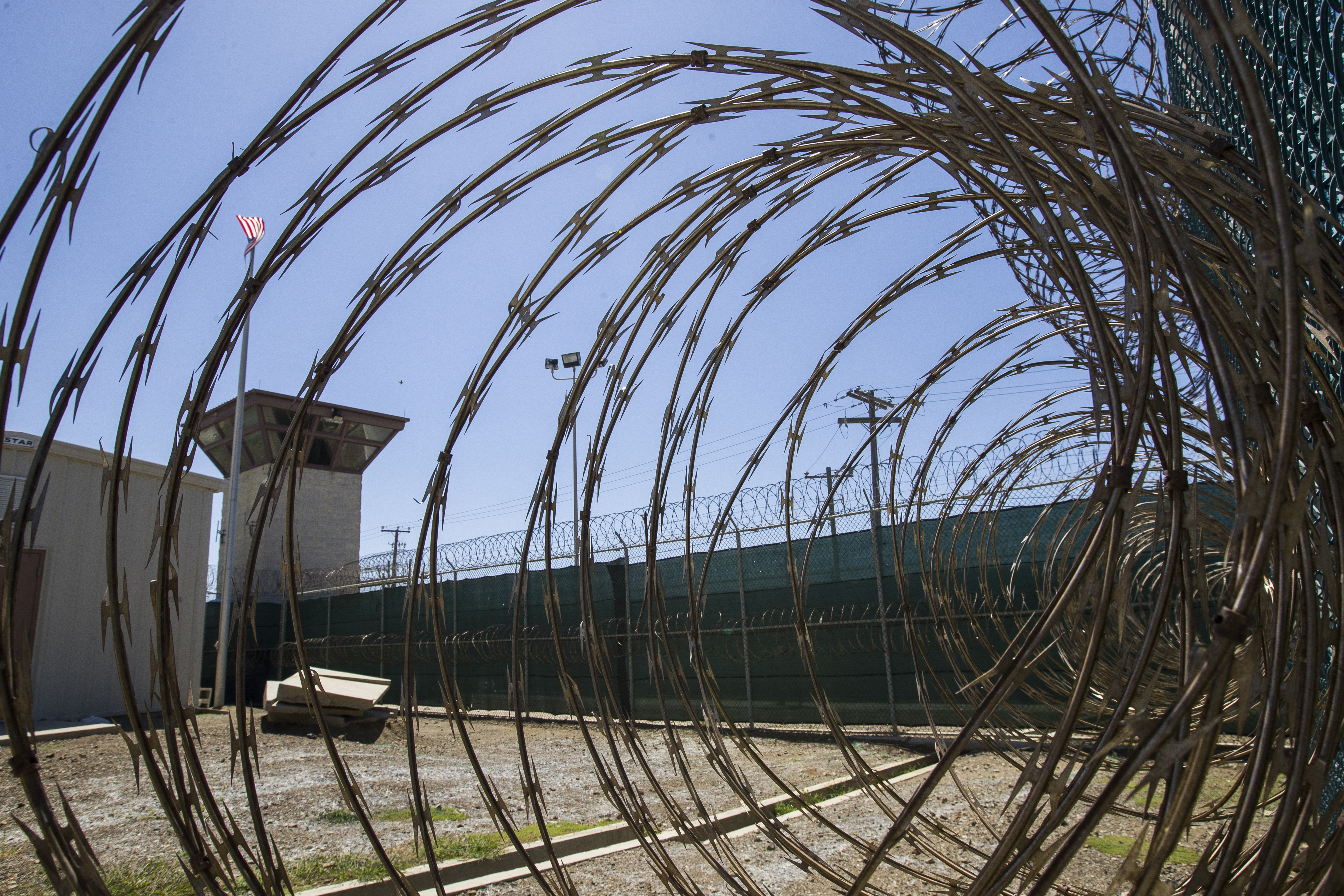 A control tower is seen through the razor wire inside the Camp VI detention facility in Guantanamo Bay, Cuba