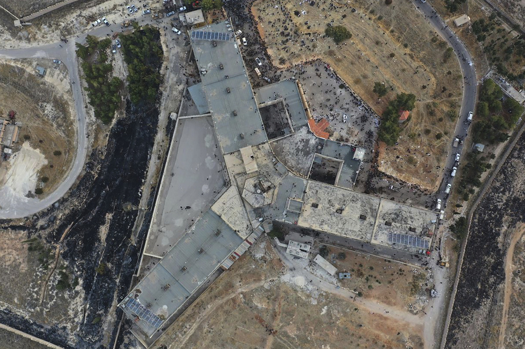 an aerial view of a prison with three wings
