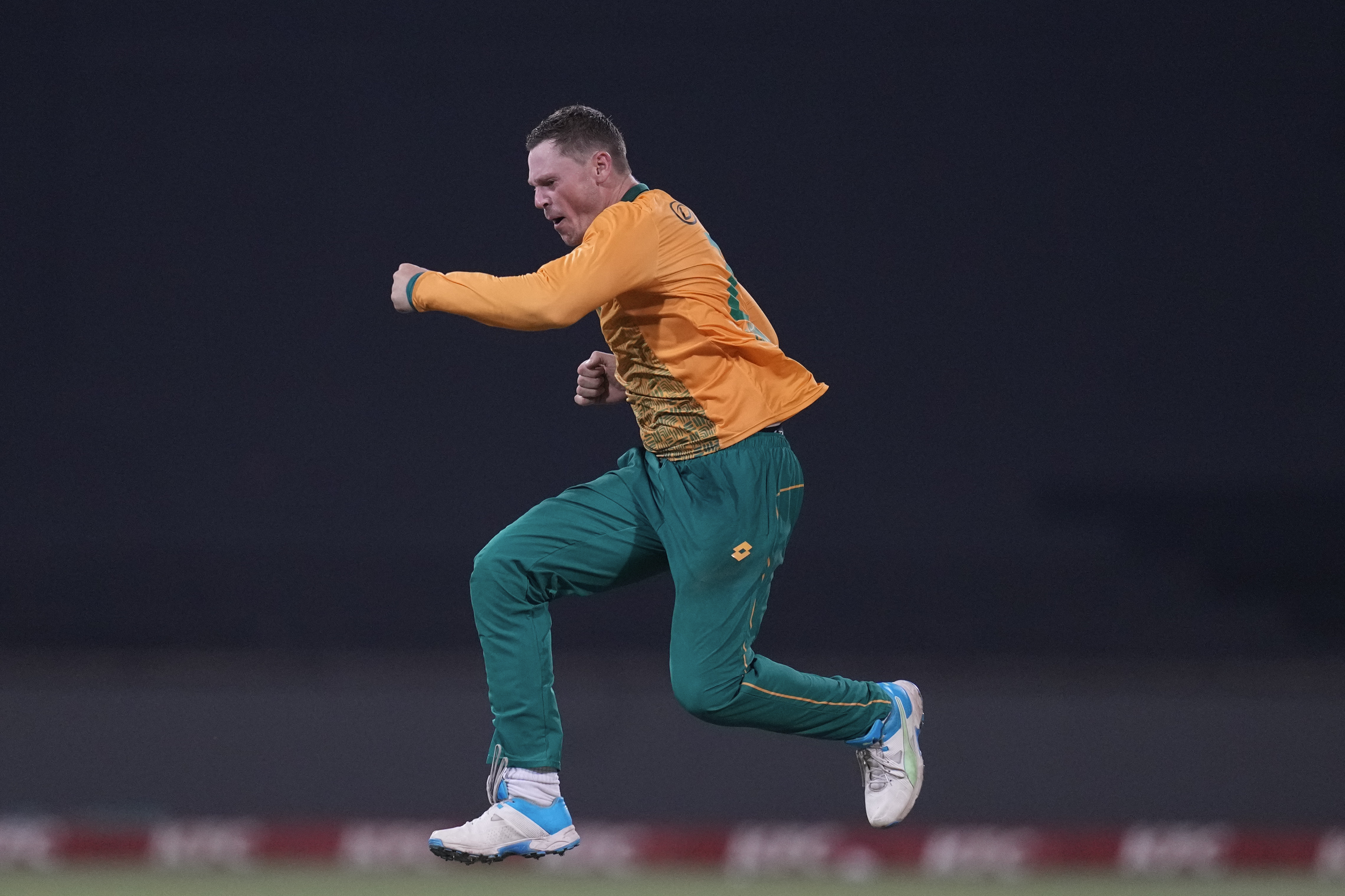 South Africa's George Linde celebrates the dismissal of Pakistan's Haris Rauf whose decision was reversed by the third umpire during the first T20 cricket match between South Africa and Pakistan at the Kingsmead stadium in Durban, South Africa, Tuesday, Dec. 10, 2024.(AP Photo/ Themba Hadebe)