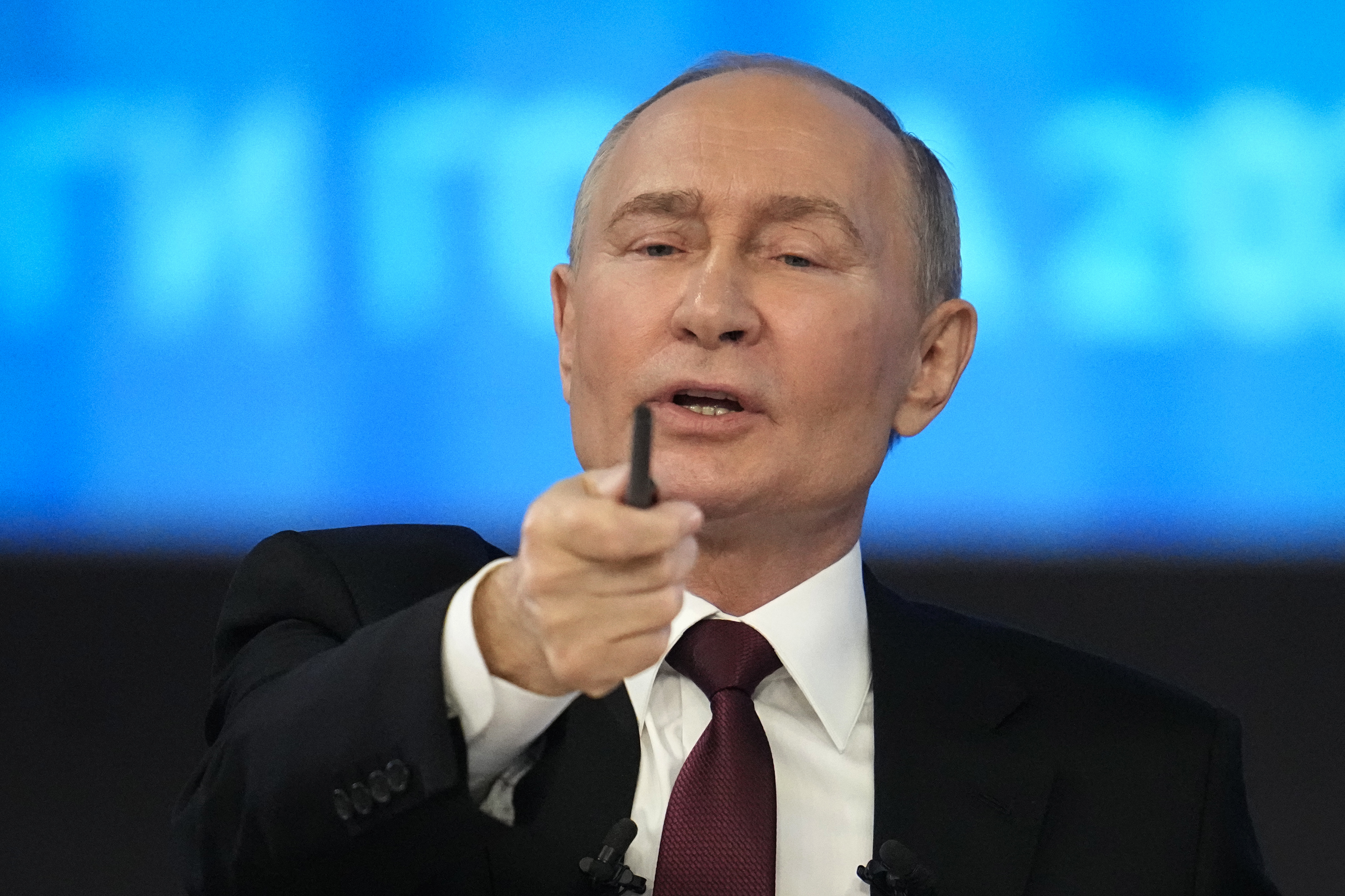 Russian President Vladimir Putin gestures during his annual news conference and call-in show, at Gostinny Dvor in Moscow, Russia, Thursday, Dec. 19